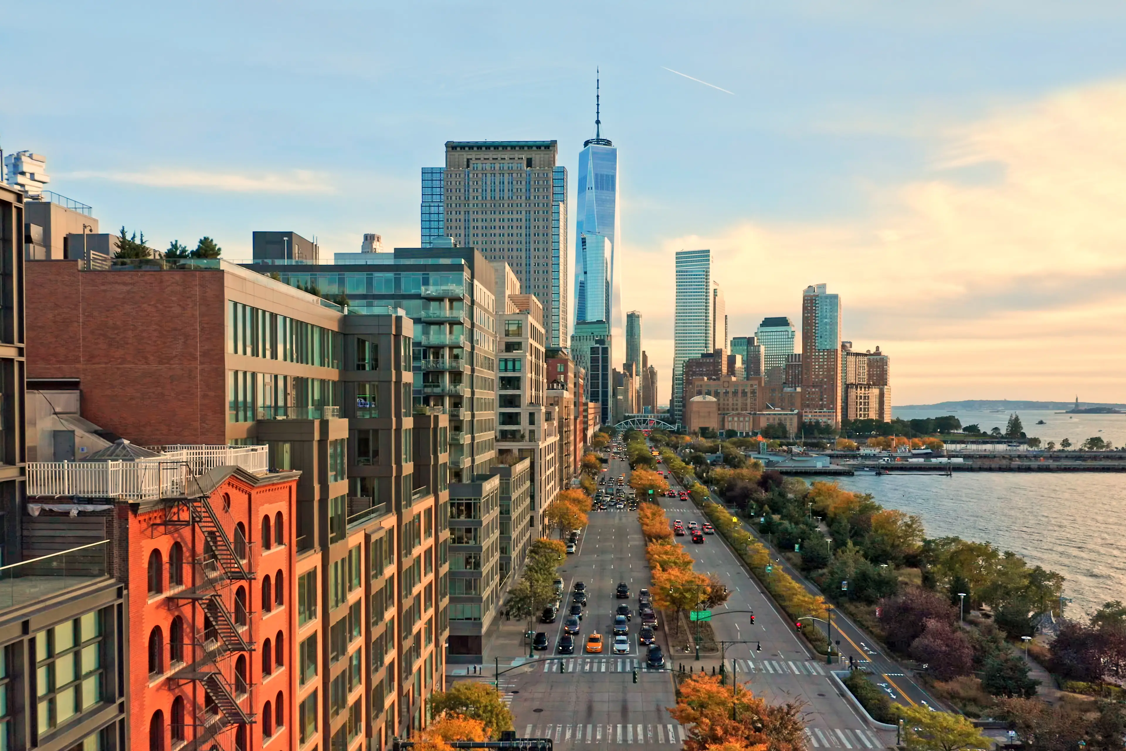 Aerial view of Lower Manhattan skyline at sunset viewed from above West Street in Tribeca