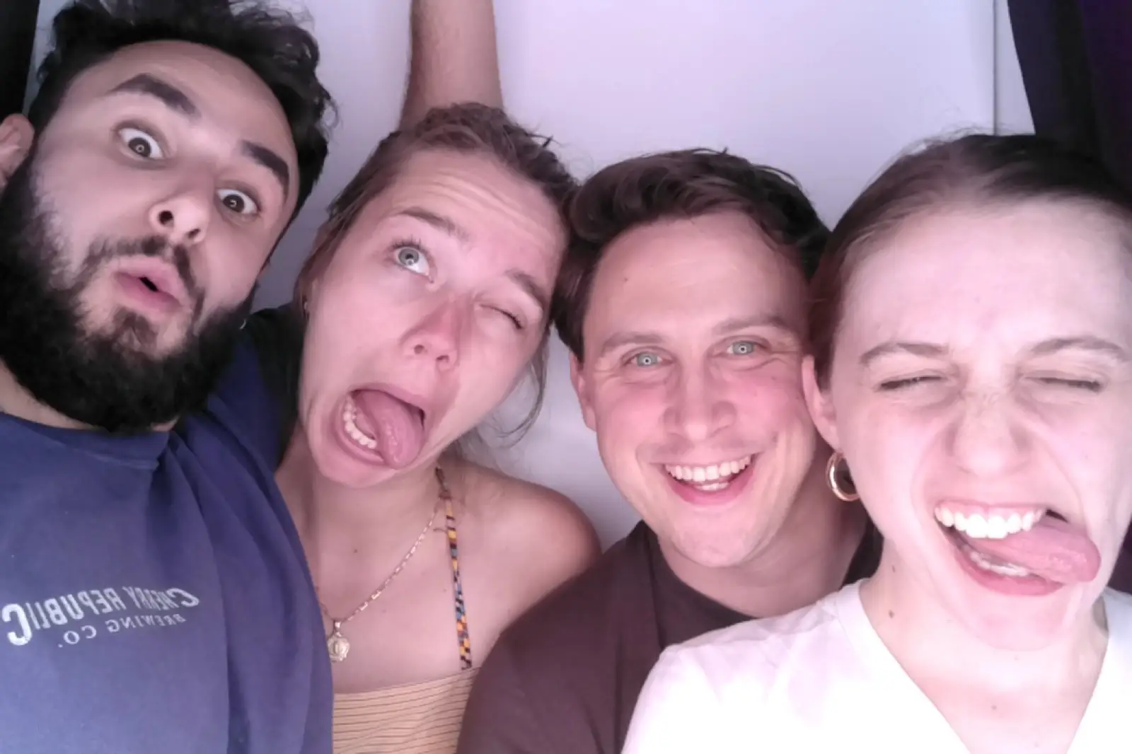 People posing for photo at a photo booth