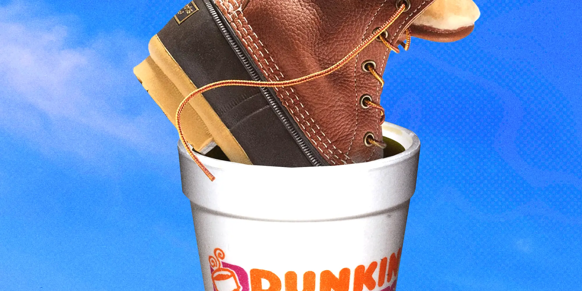 Brown leather LL Bean boot sits inside a white Dunkin cup against a yellow background.