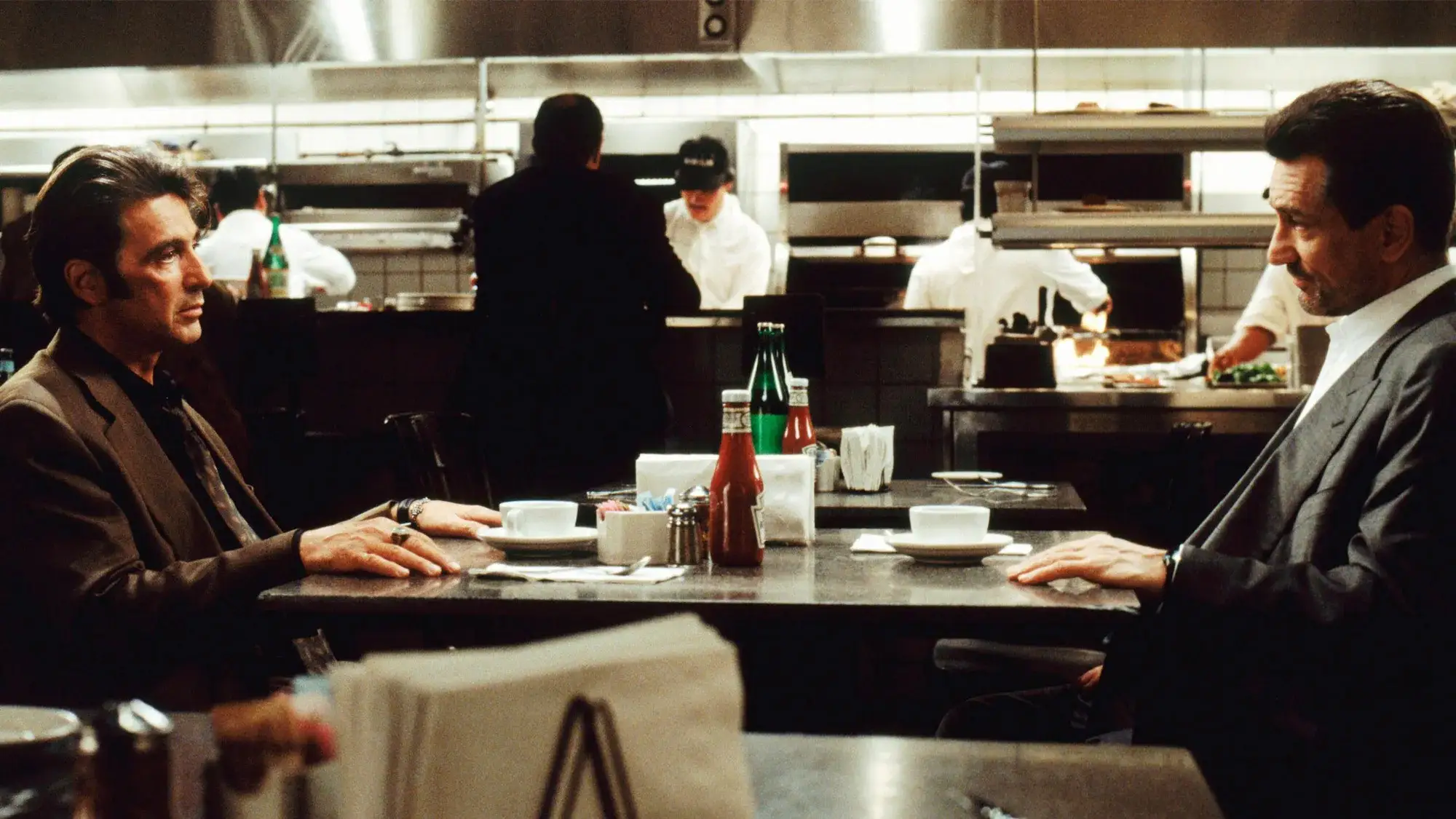 Al Pacino and Robert De Niro sitting in a coffee shop in Heat movie