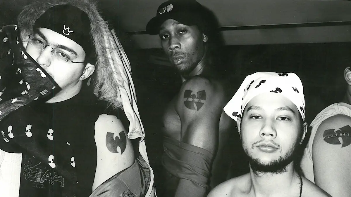 Rza and others with Wu Tang symbol on their arm