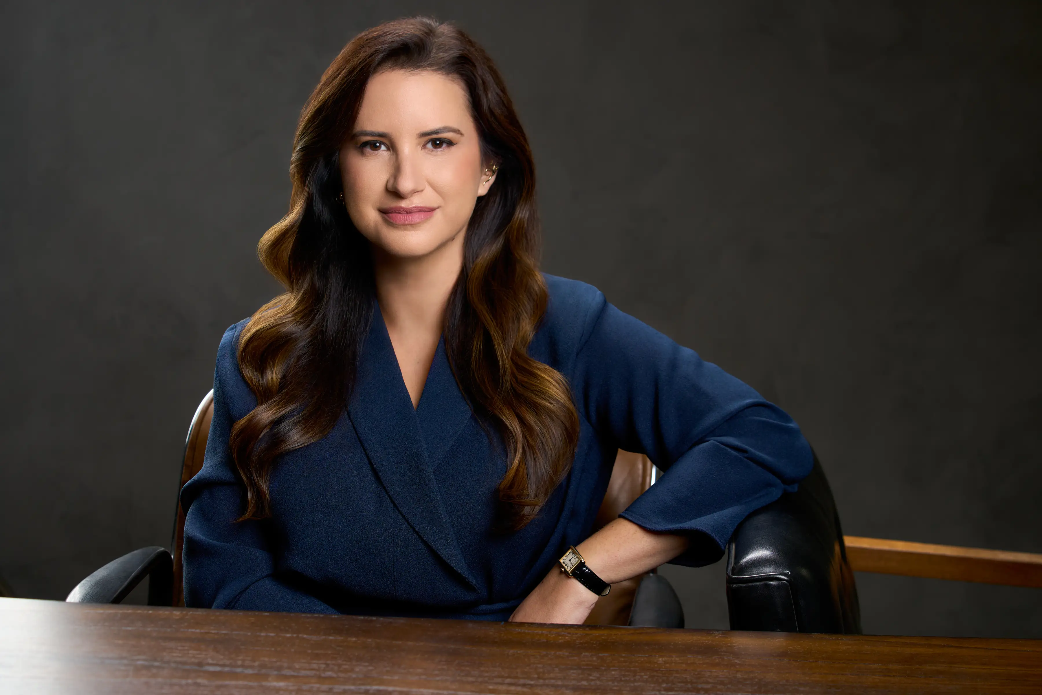 head shot of a woman in a blue blazer