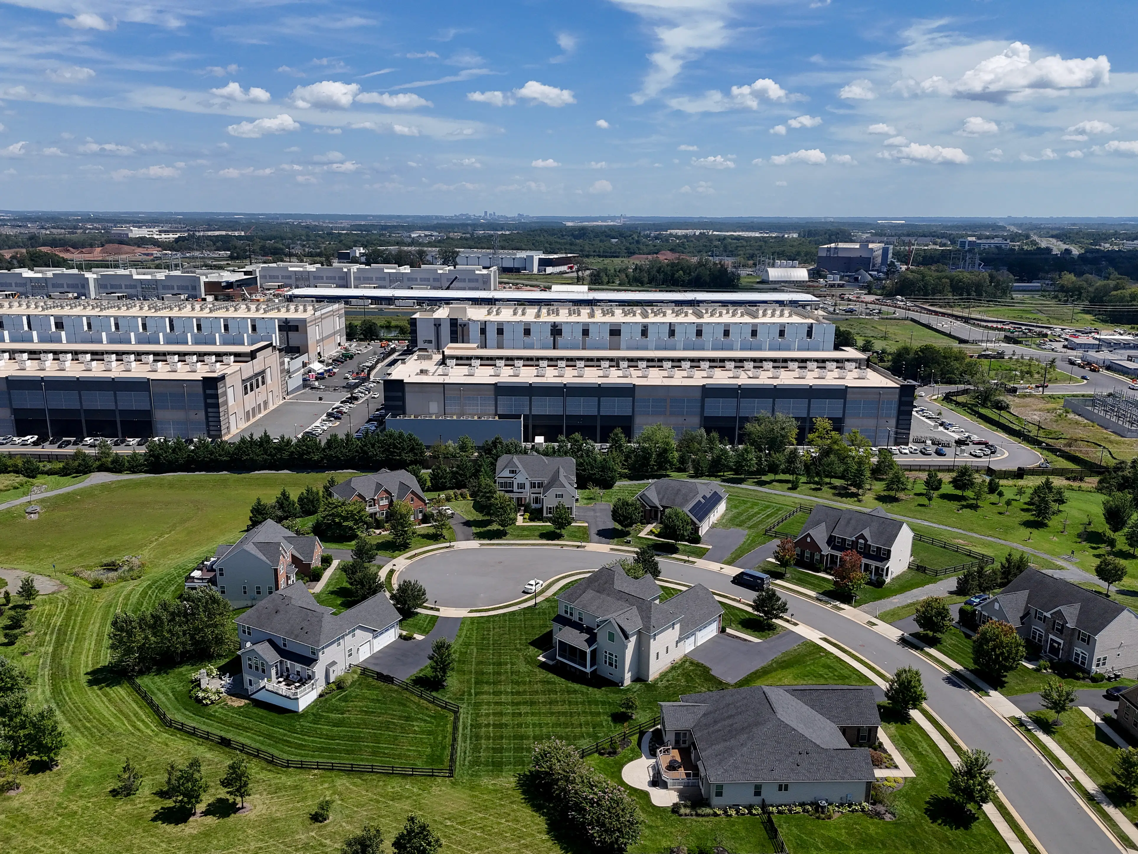 An aerial view shows data centers near a Virginia neighborhood