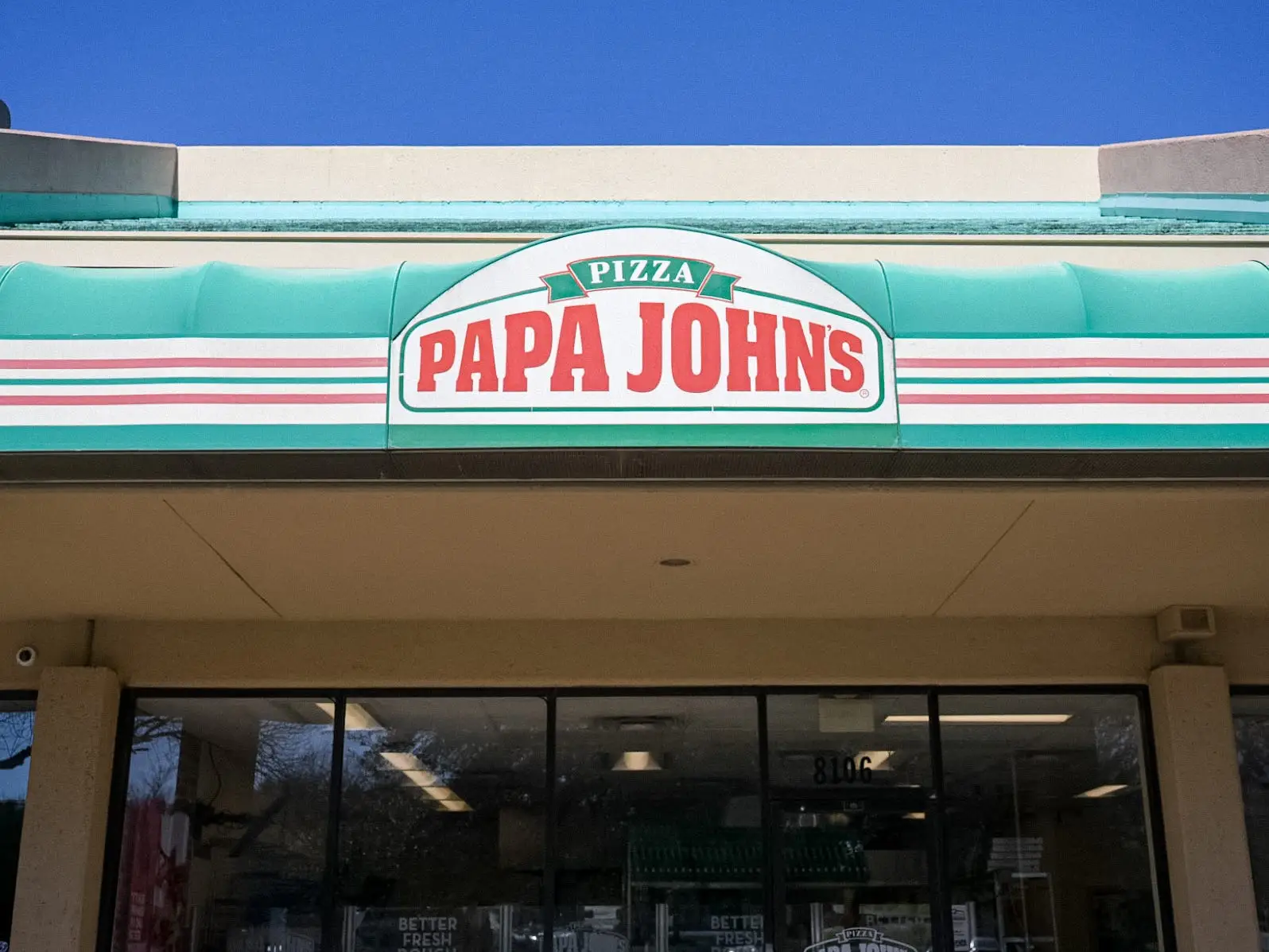 A Papa John's restaurant is seen on February 27, 2026 in Austin, Texas. Papa John's international is preparing to close 300 of its Northern American stores by the end of 2027 in an effort to further turnaround business amid nationwide ongoing pizza sector struggles.