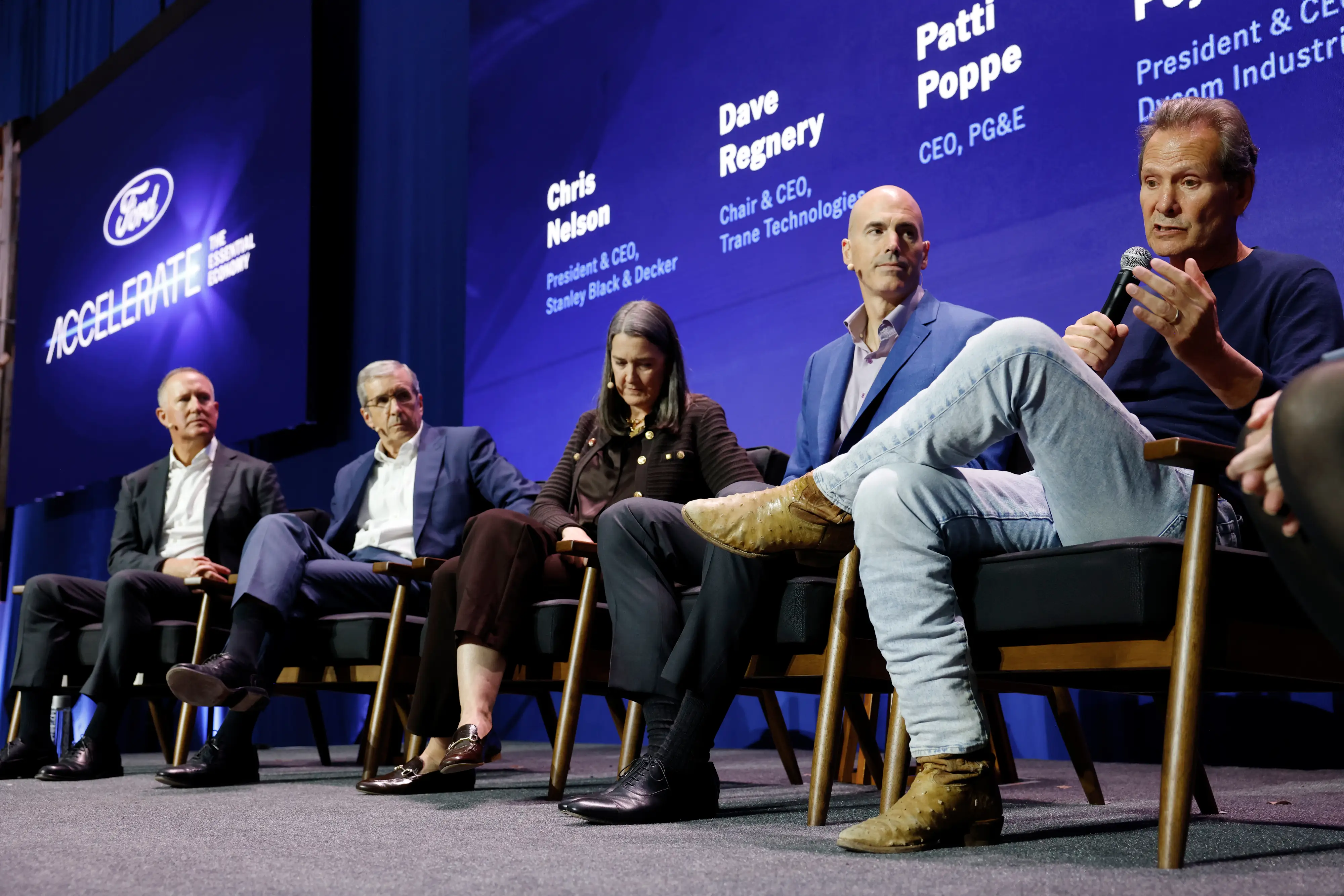 Several CEOs sit on stage during the Ford Accelerate conference. From left, Chris Nelson of Stanley Black & Decker; Dave Regnery of Trane Technologies; Patti Poppe of PG&E; Daniel Payovich of Dycom; and Dan Schulman of Verizon.