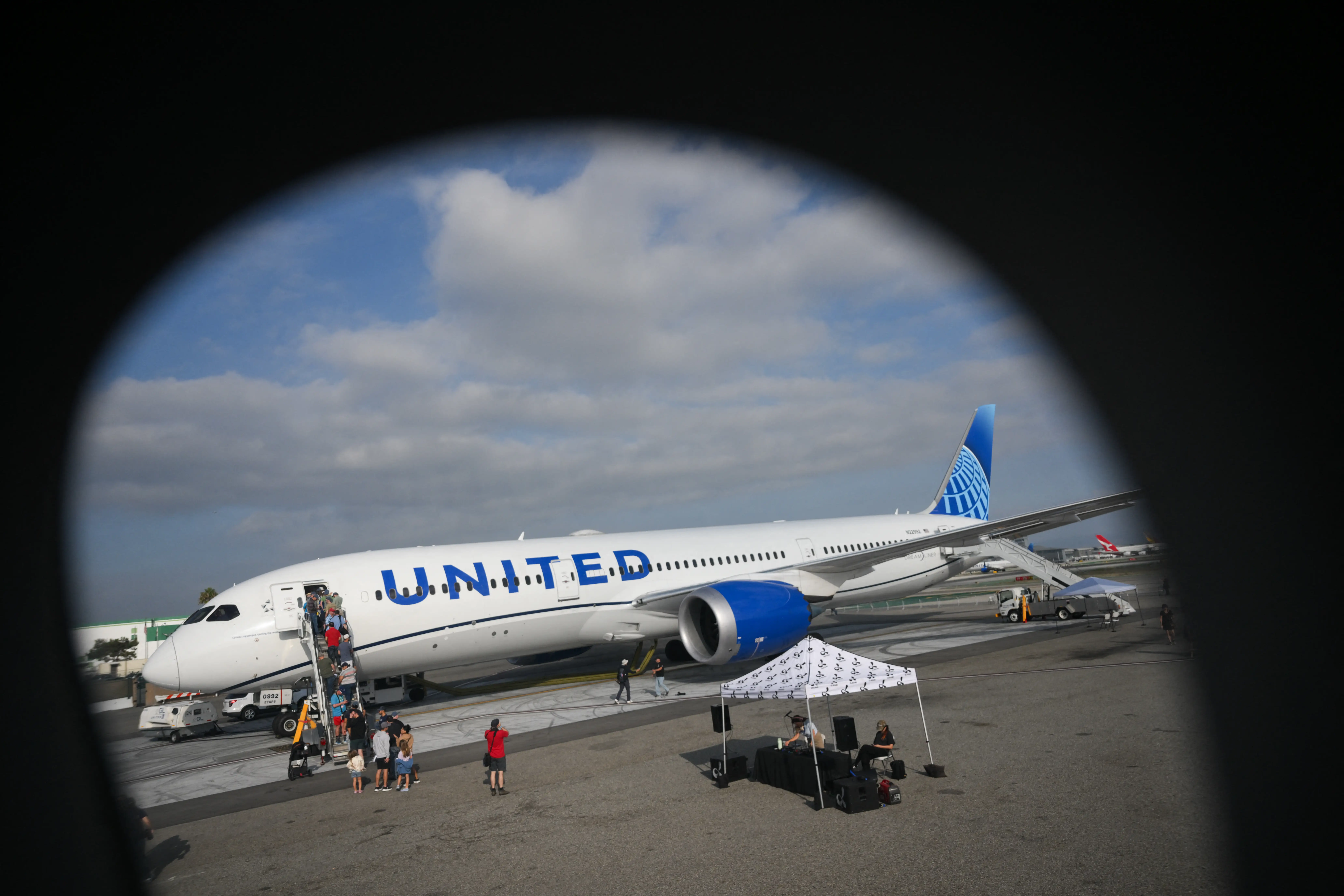 People tour a United Airlines Boeing 787 Dreamliner.