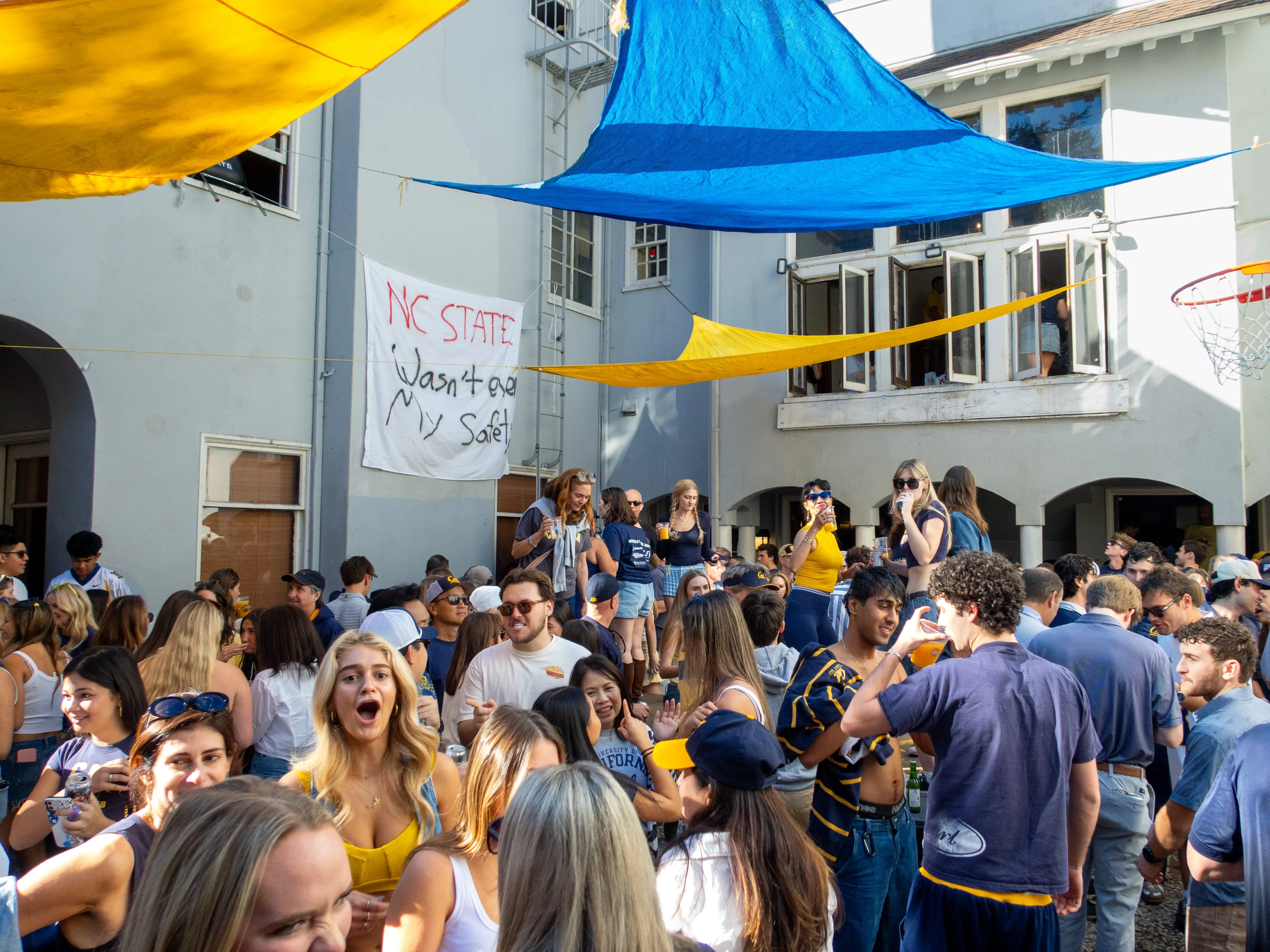 A crowd of students and parents is seen during a party held at a fraternity house before a football game between Cal and NC State at University of California, Berkeley, on October 19, 2024, in Berkeley, California. During this 