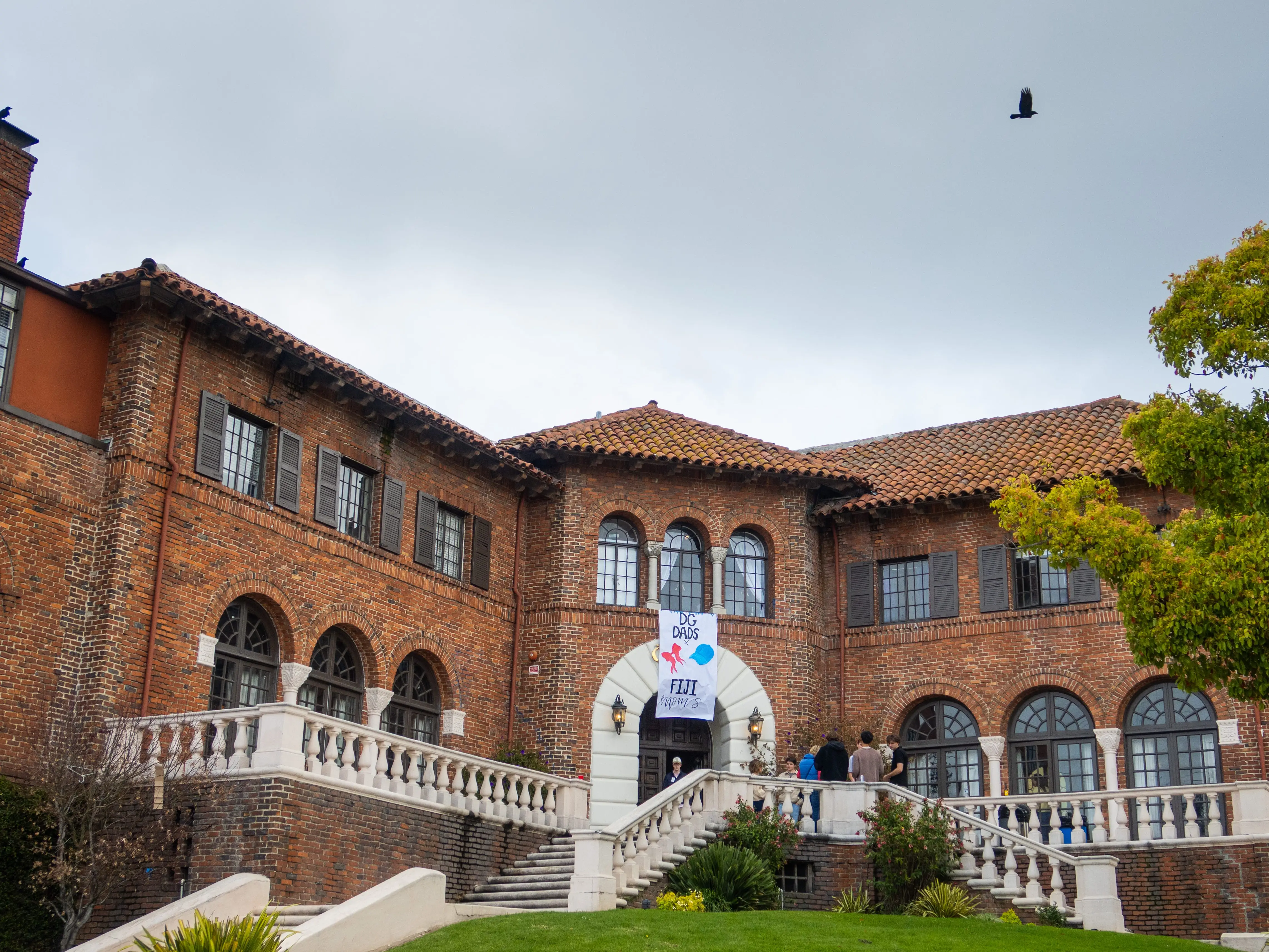 The Phi Gamma Delta fraternity house, at University of California, Berkeley seen with a poster hanging at their entrance celebrating a party for parents in conjunction with the Delta Gamma sorority on March 15, 2024, in Berkeley, California.