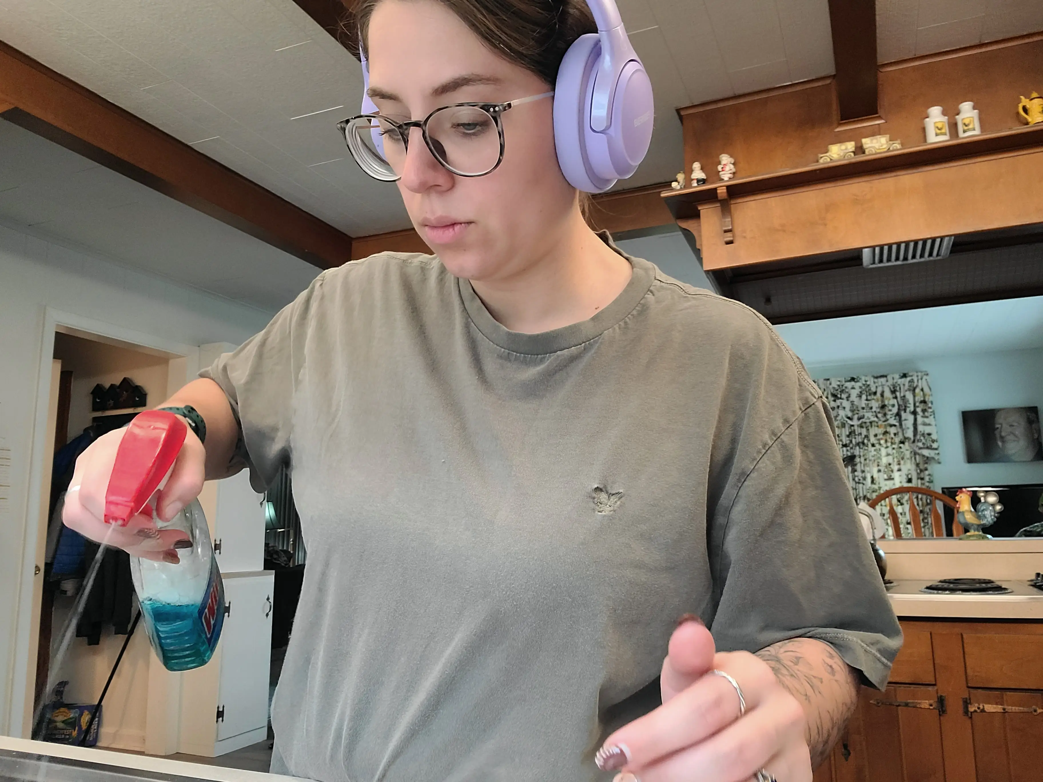 Woman with headphones cleaning