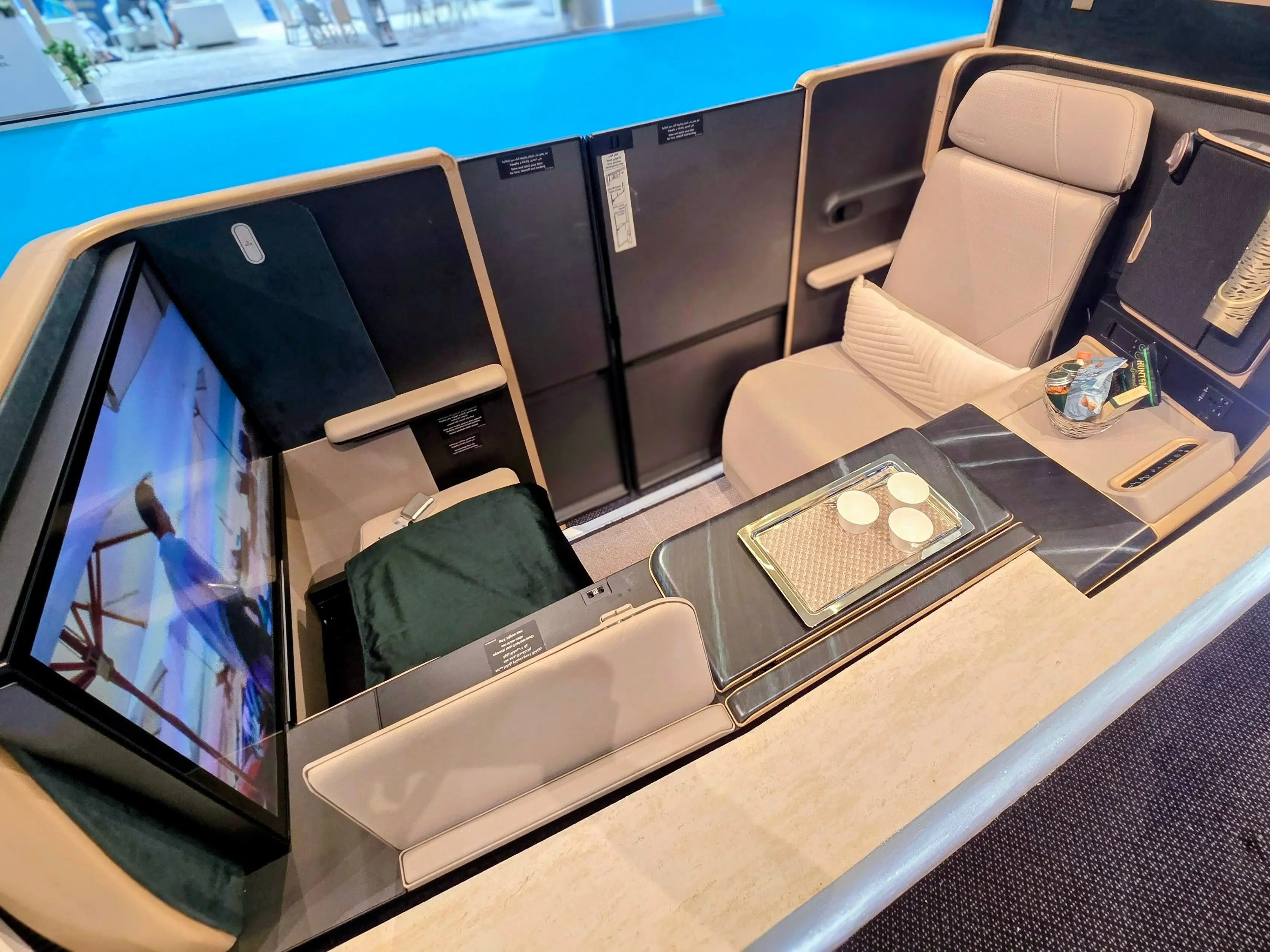 The first class Etihad suite on A330neo mock up. Its beige and brown.