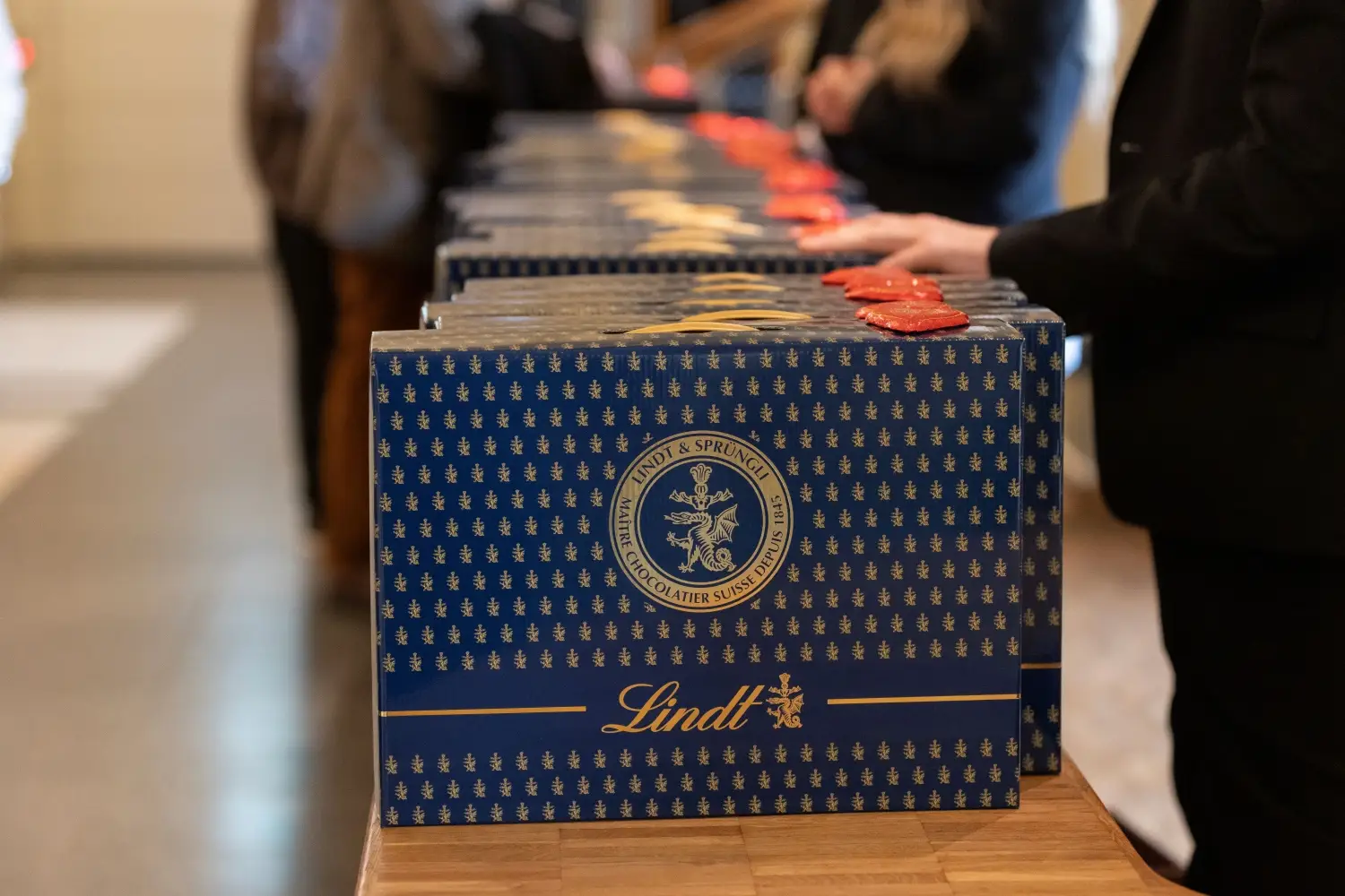Lindt hands out chocolate-filled briefcases to shareholders.