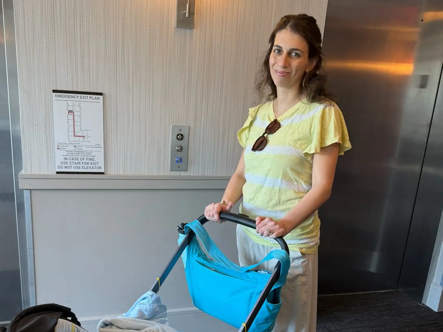 the author iwth a stroller in the lobby of an apartment building