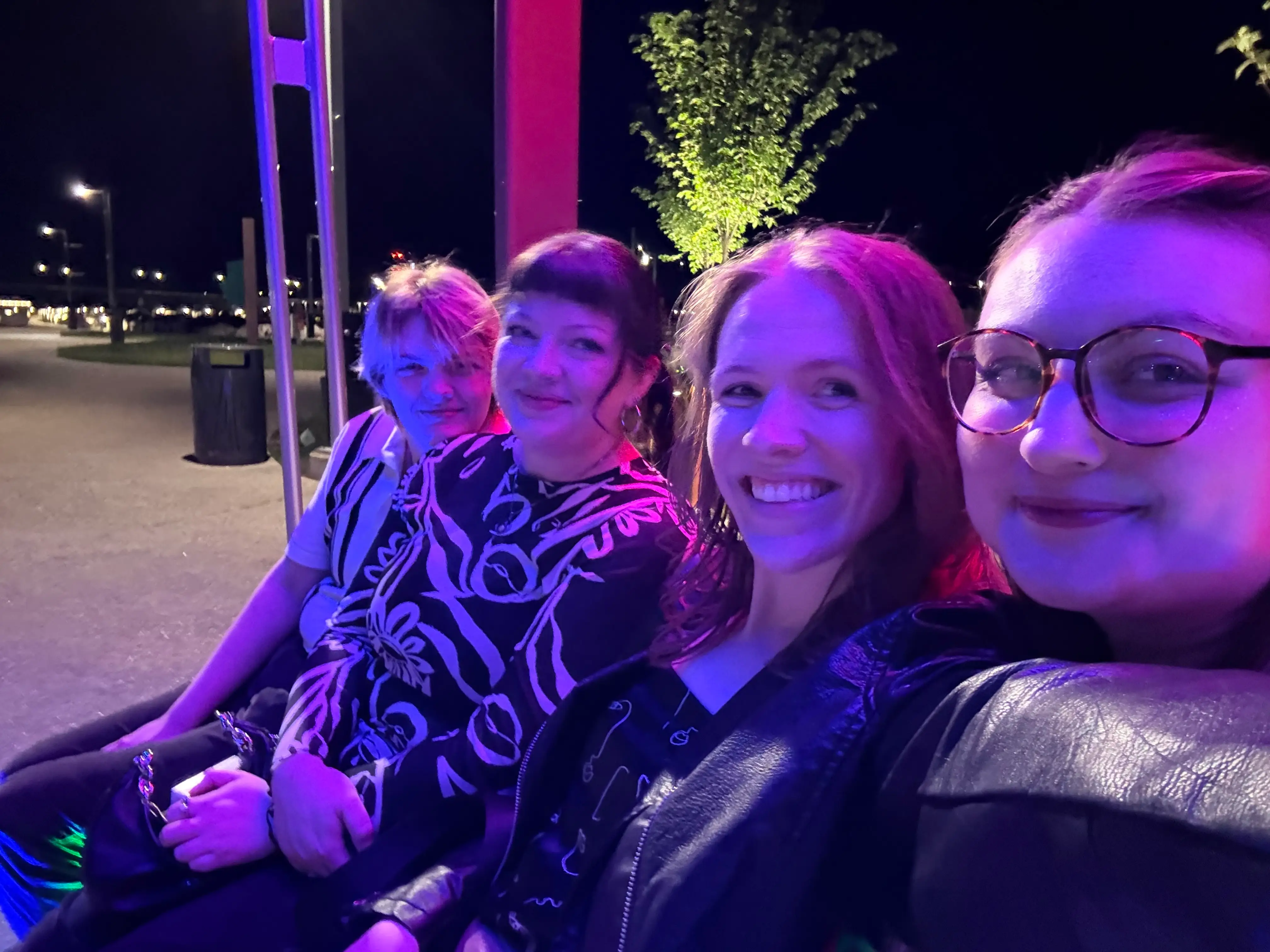 The writer is posing for a selfie with her girlfriend and two other roommates.