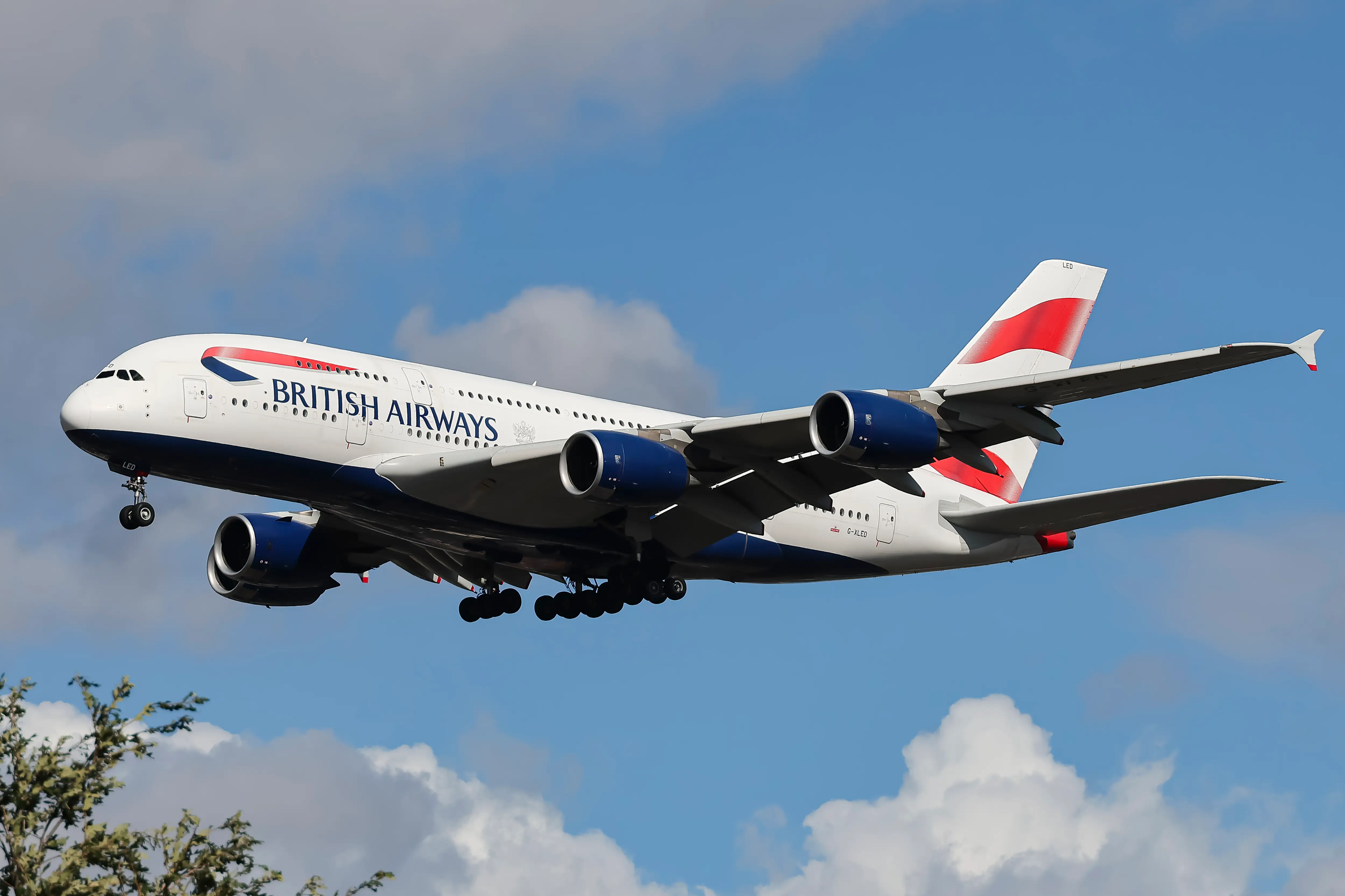 British Airways Airbus A380 Superjumbo passenger aircraft, spotted flying on final approach for landing on London Heathrow Airport runway in the United Kingdom. The double decker wide body airliner is the world's largest jet. The BA A380 airplane has the registration tail number G-XLED and is powered by 4x RR Trent 970 engines. The pictured airplane is arriving from Johannesburg JNB International Airport in South Africa as Flight BA56. British Airways is the flag carrier airline of the United Kingdom with main hub at Heathrow Airport, operating a fleet of 244 planes and member of Oneworld aviation alliance group. Since 2011 BA merged with Iberia creating the International Airlines Group IAG, the third largest airline group in the world. September 11, 2024 (Photo by Nicolas Economou/NurPhoto via Getty Images)