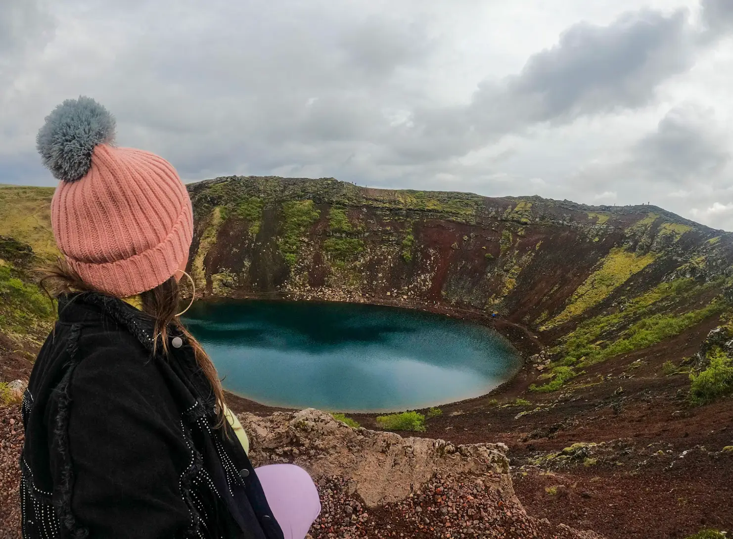 The writer gazing out at a crater in Iceland.