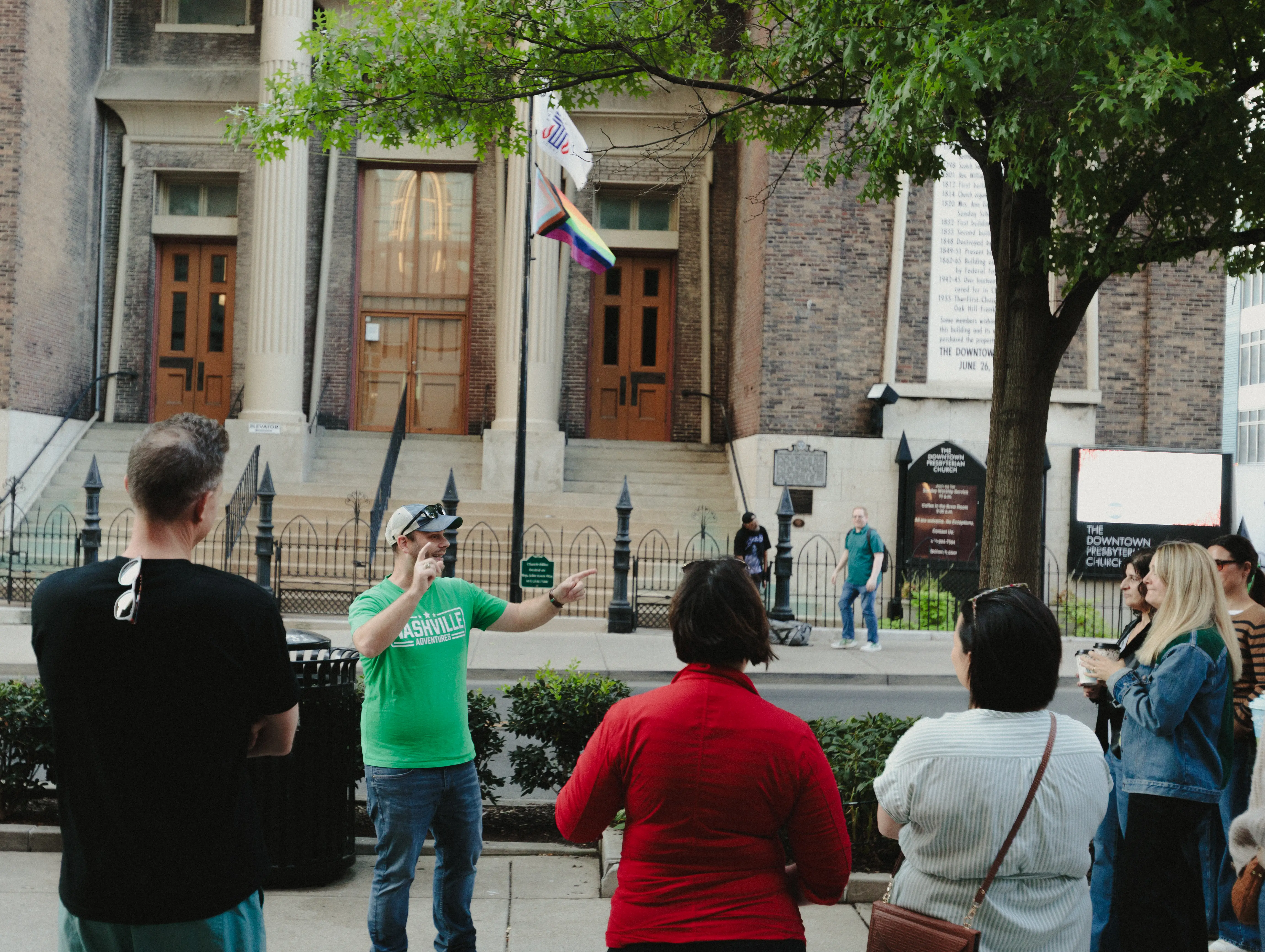Paul addresses a sidewalk group outside The Downtown Presbyterian Church.