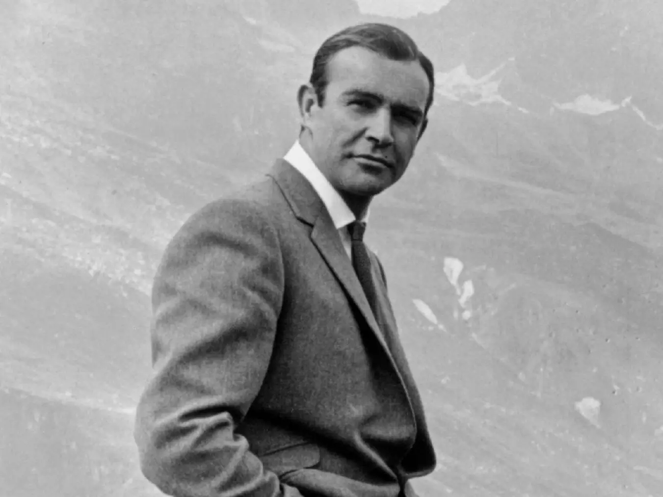 1964: Actor Sean Connery poses as James Bond next to his Aston Martin DB5 in a scene from the United Artists release 'Goldfinger' in 1964