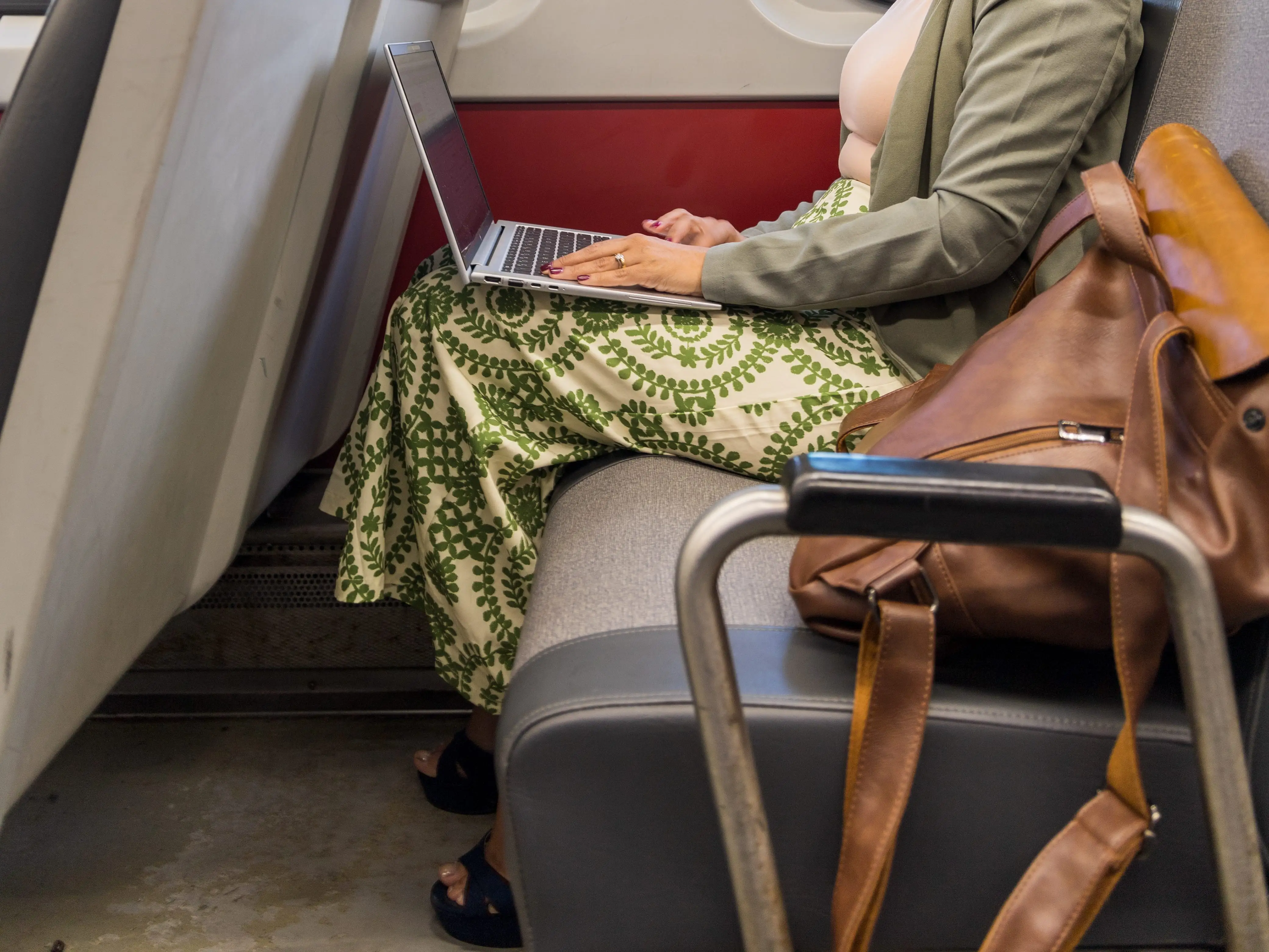 A woman works on a train.