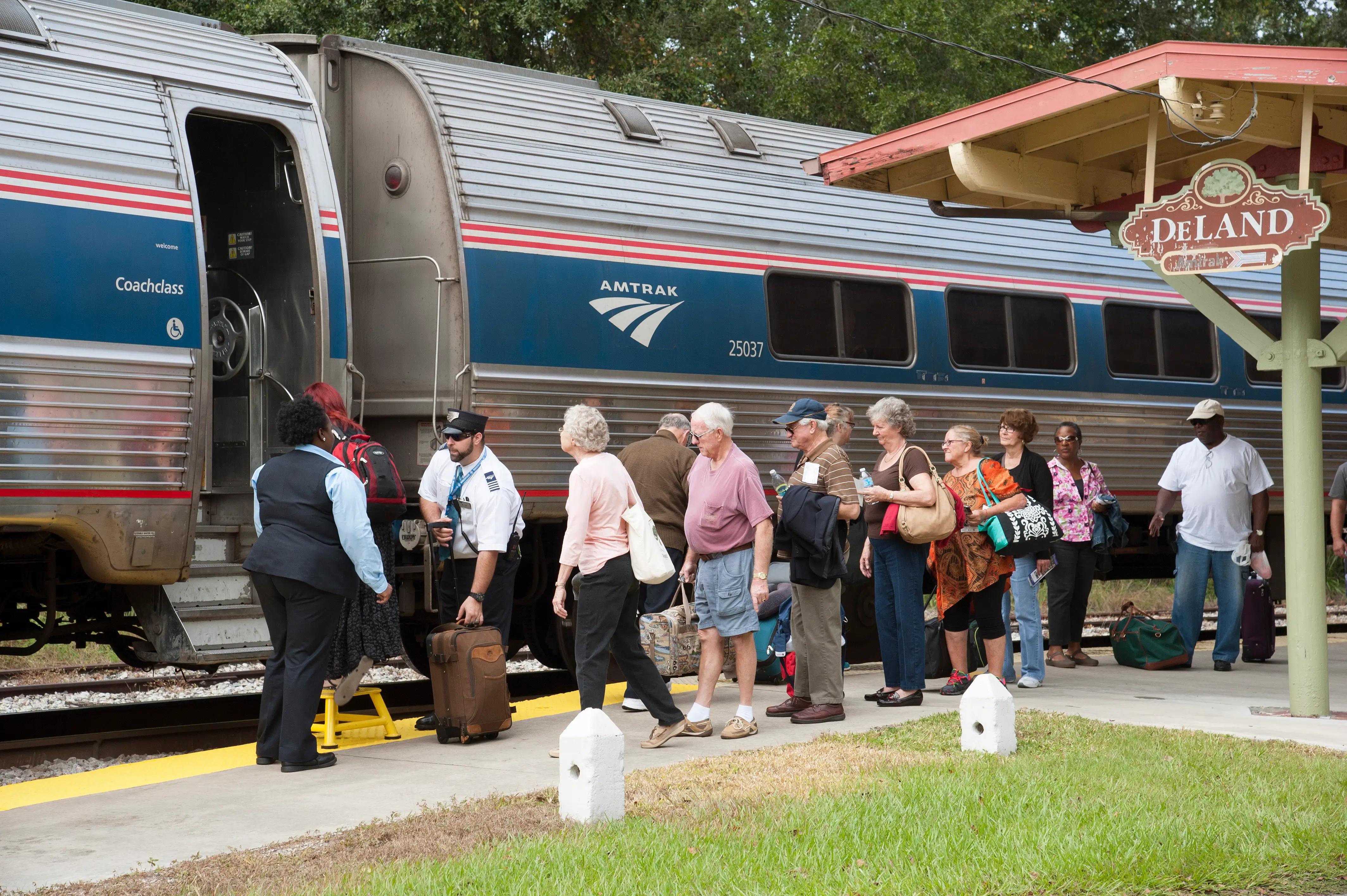 Passengers board a train.