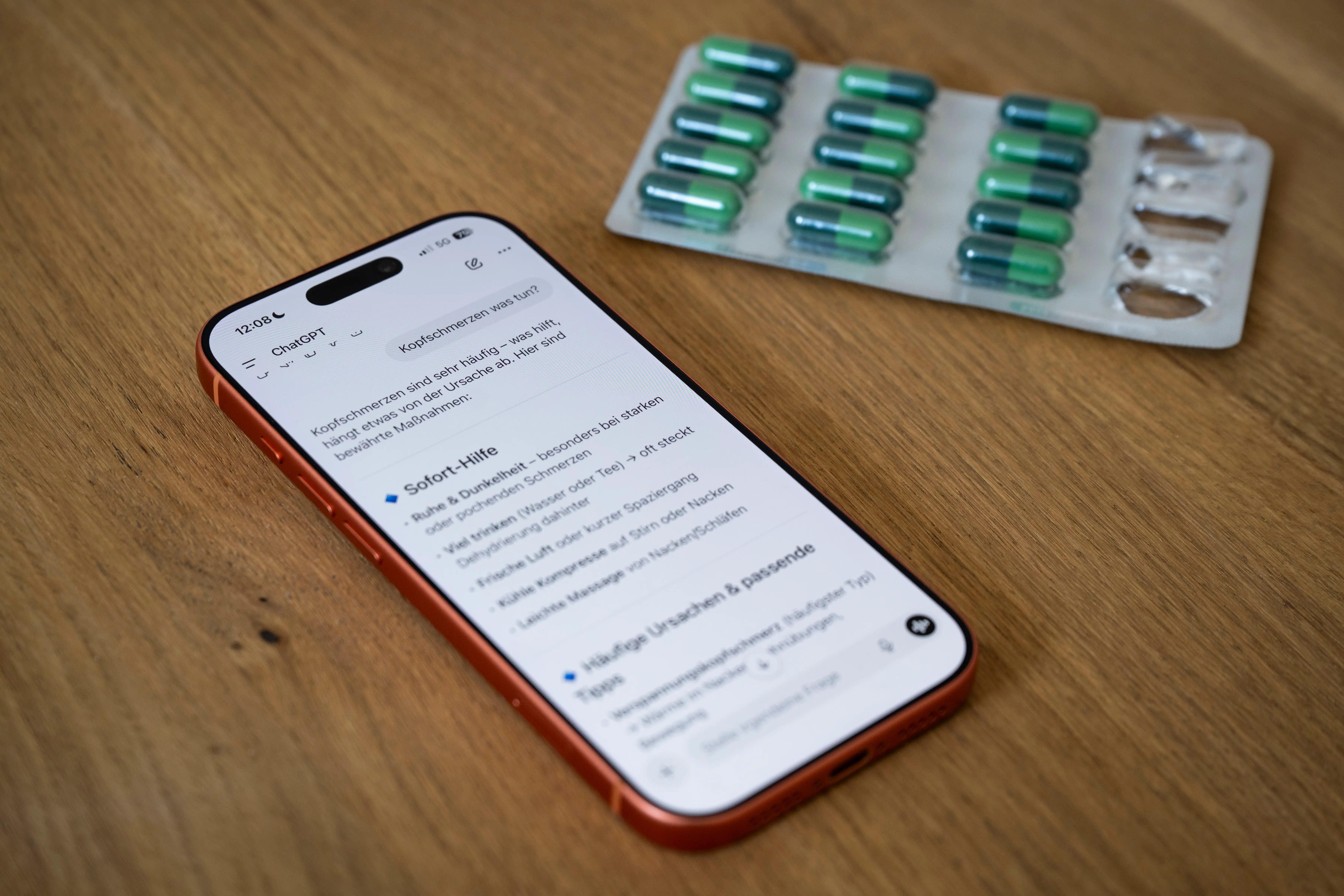 The ChatGPT app is open next to a blister pack of pills.