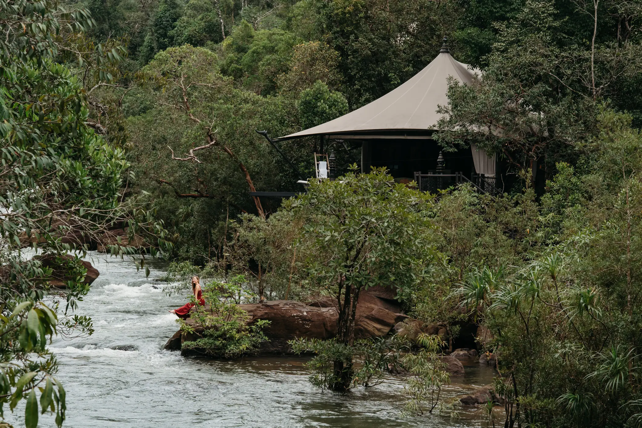 A woman near a river in Cambodia.
