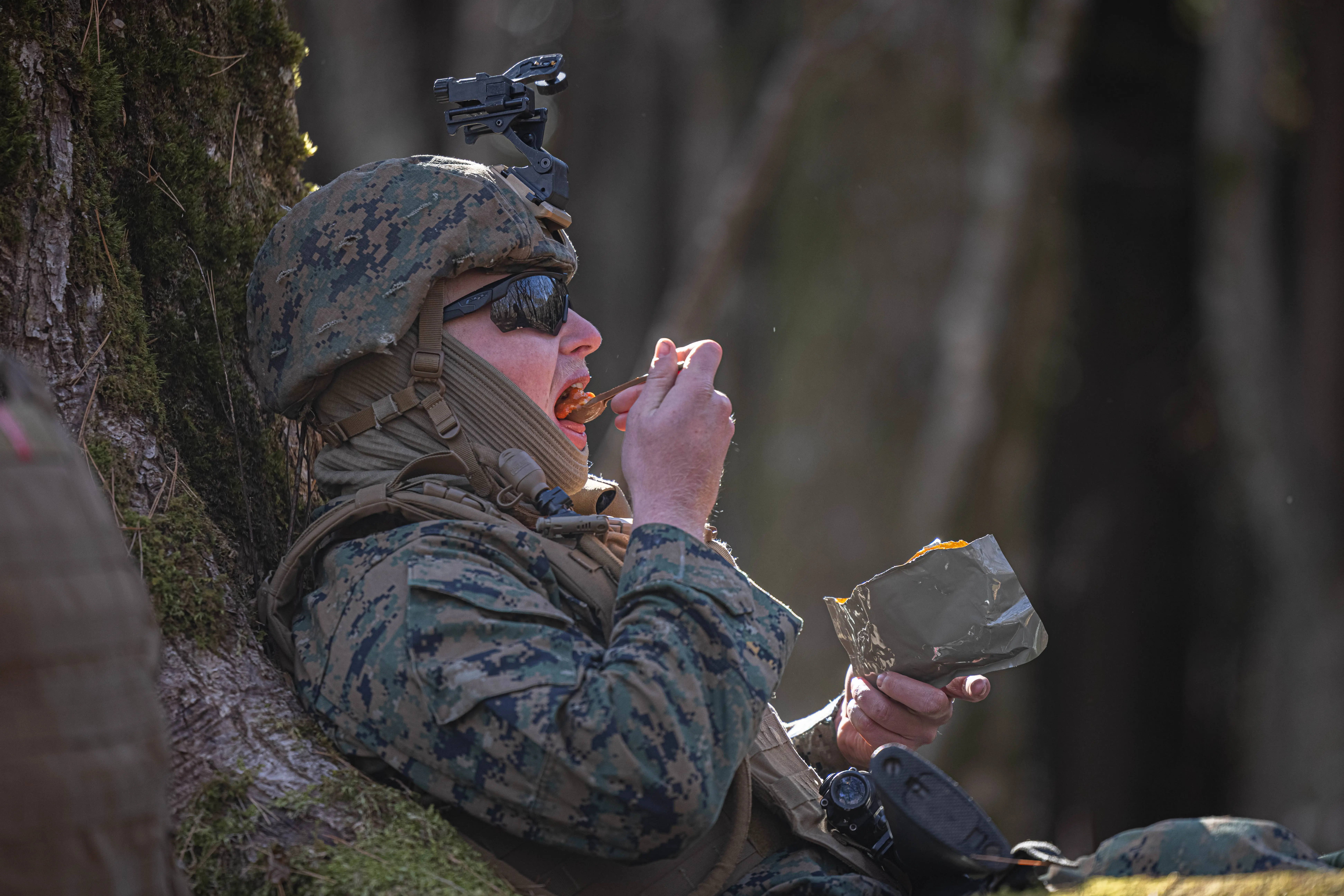 A Marine eats a field ration