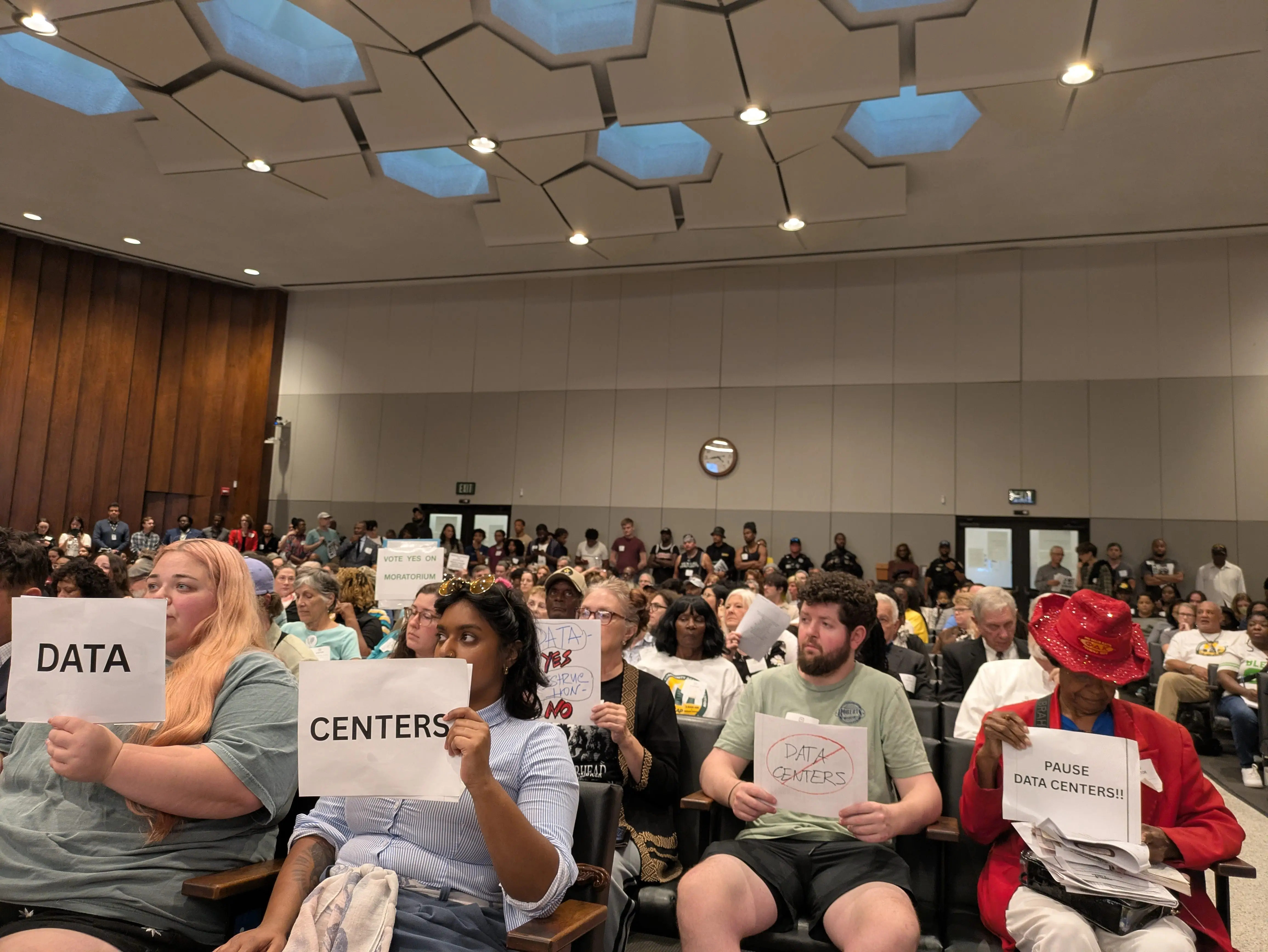 Audience members at a Memphis City Council meeting.