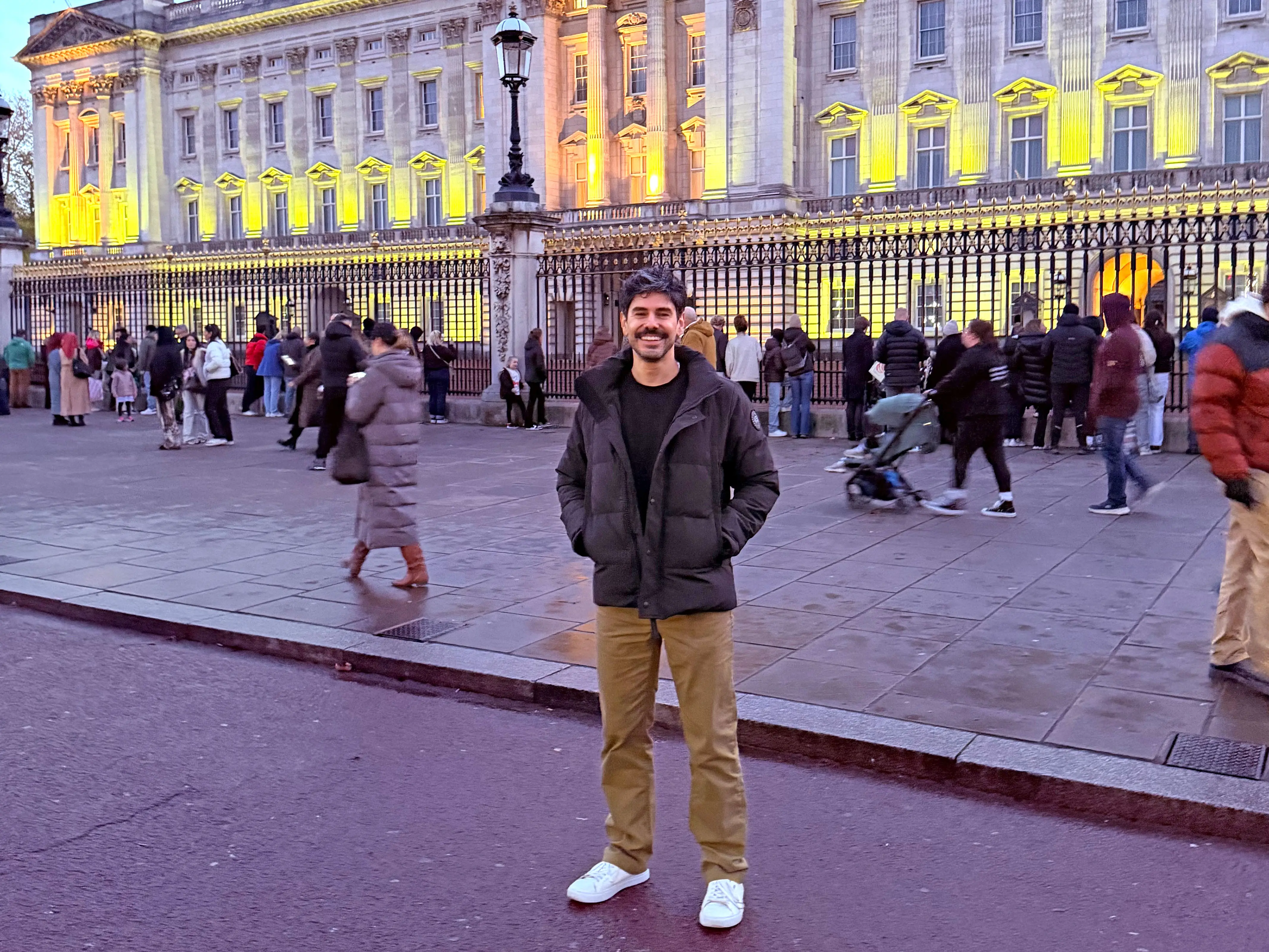 Sean stands outside Buckingham Palace.