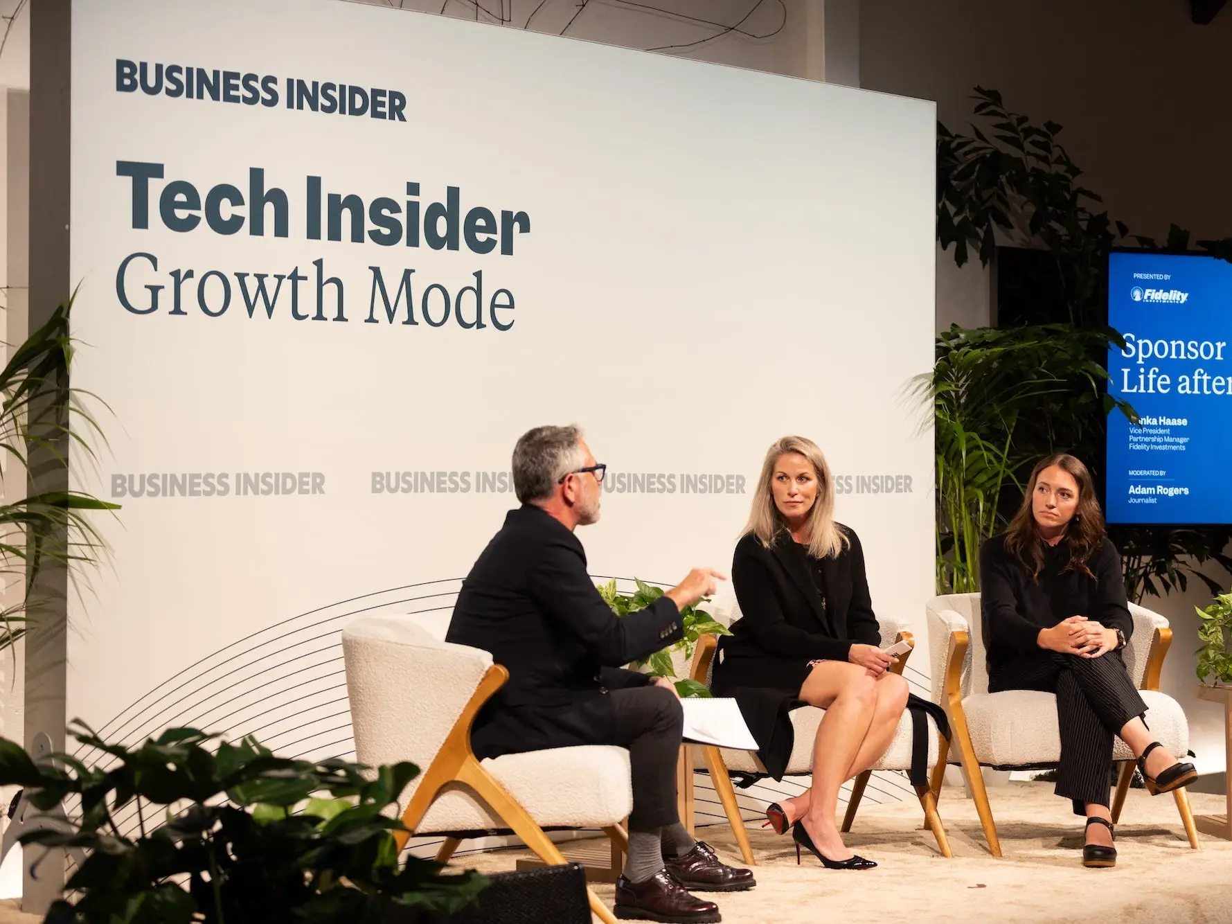 Three panelists sit onstage at a Business Insider Tech Insider Growth Mode event with a Fidelity sponsor screen.