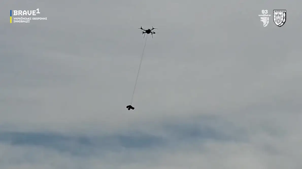 A heavy bomber drone carries a UGV.