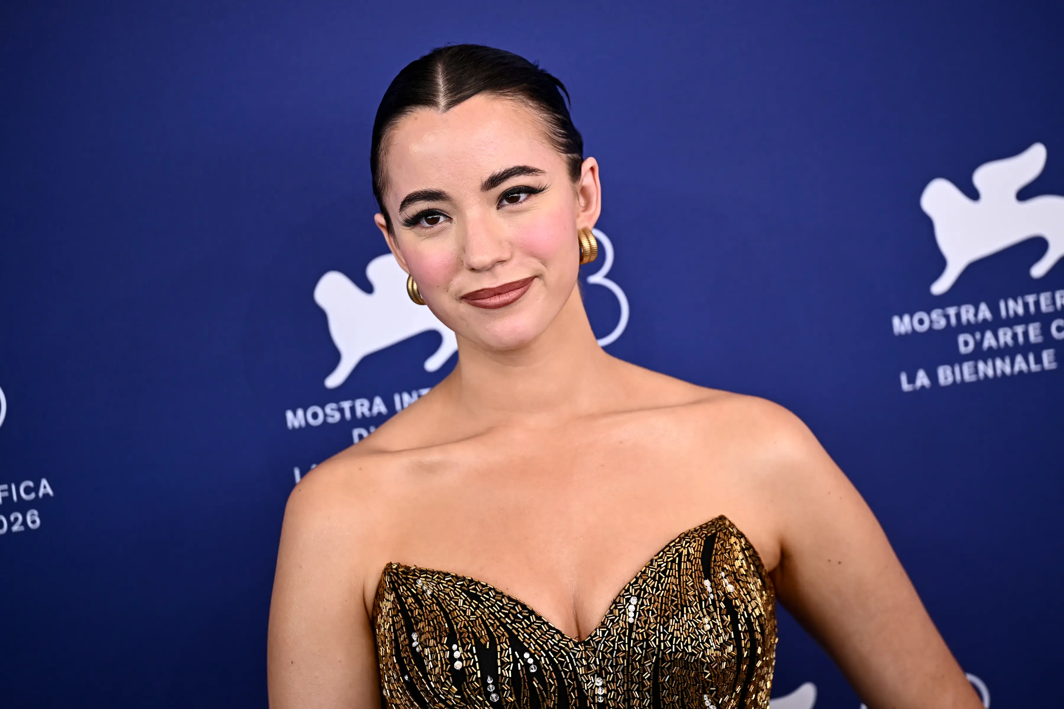 Ashley St. Clair in a gold dress