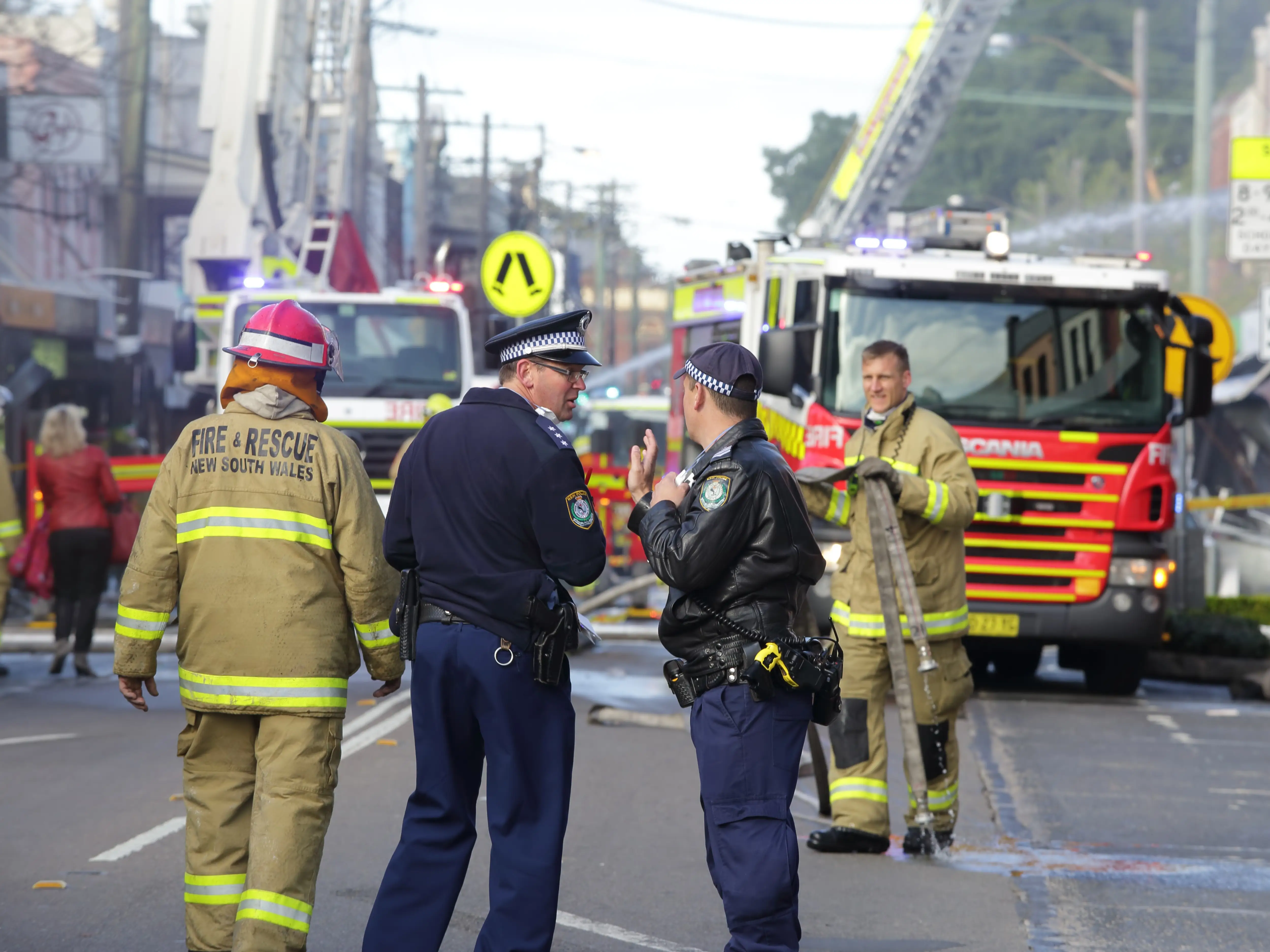 Police and Fire fighters attend blast explosion at shop stock photo