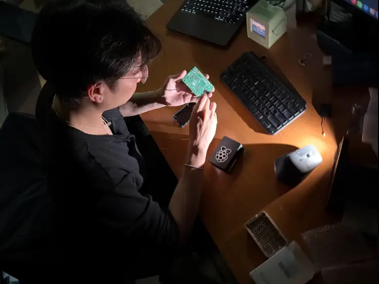 Gen Zer is working in the dark at his desk.