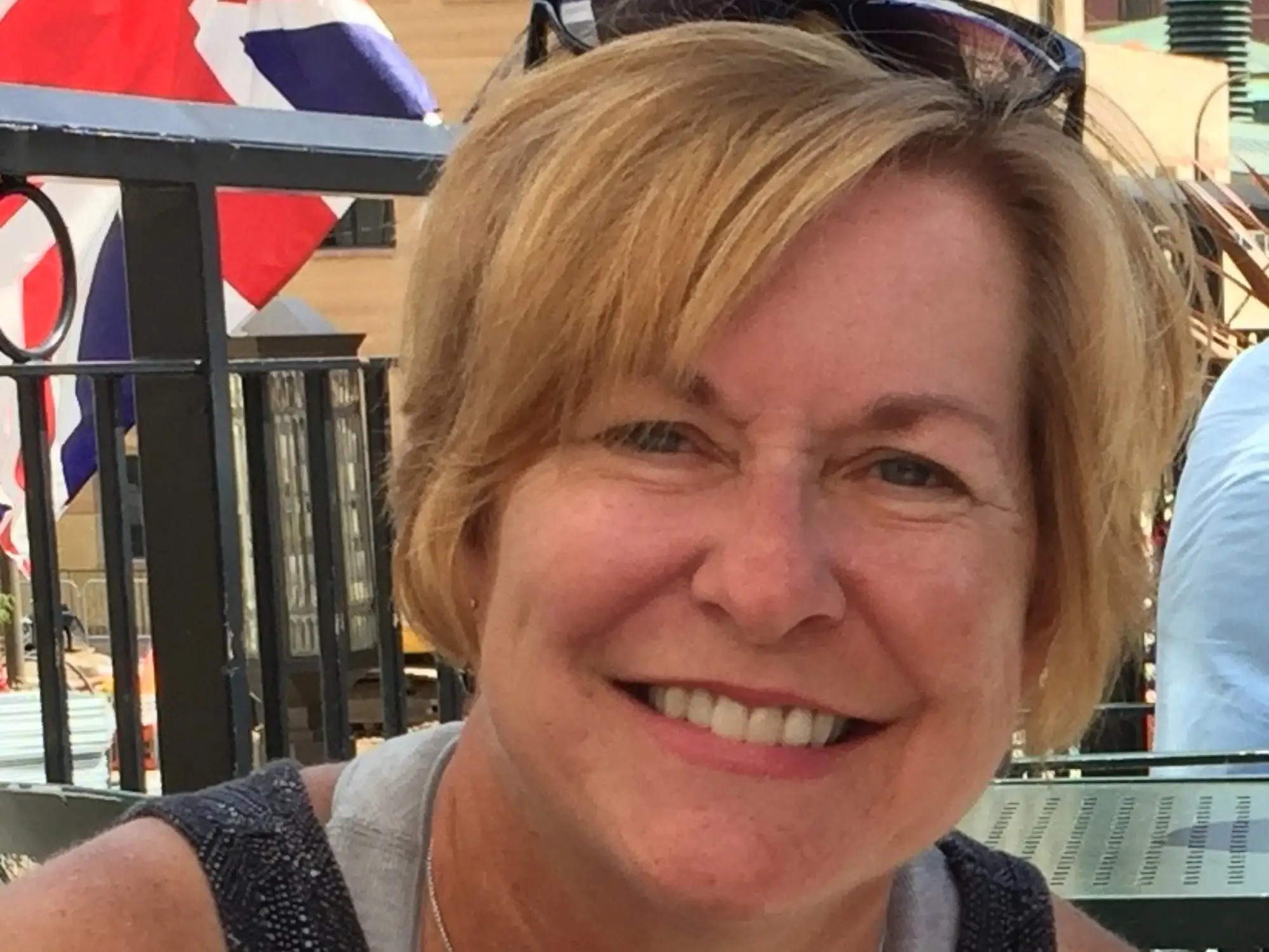Woman with short blond hair smiles