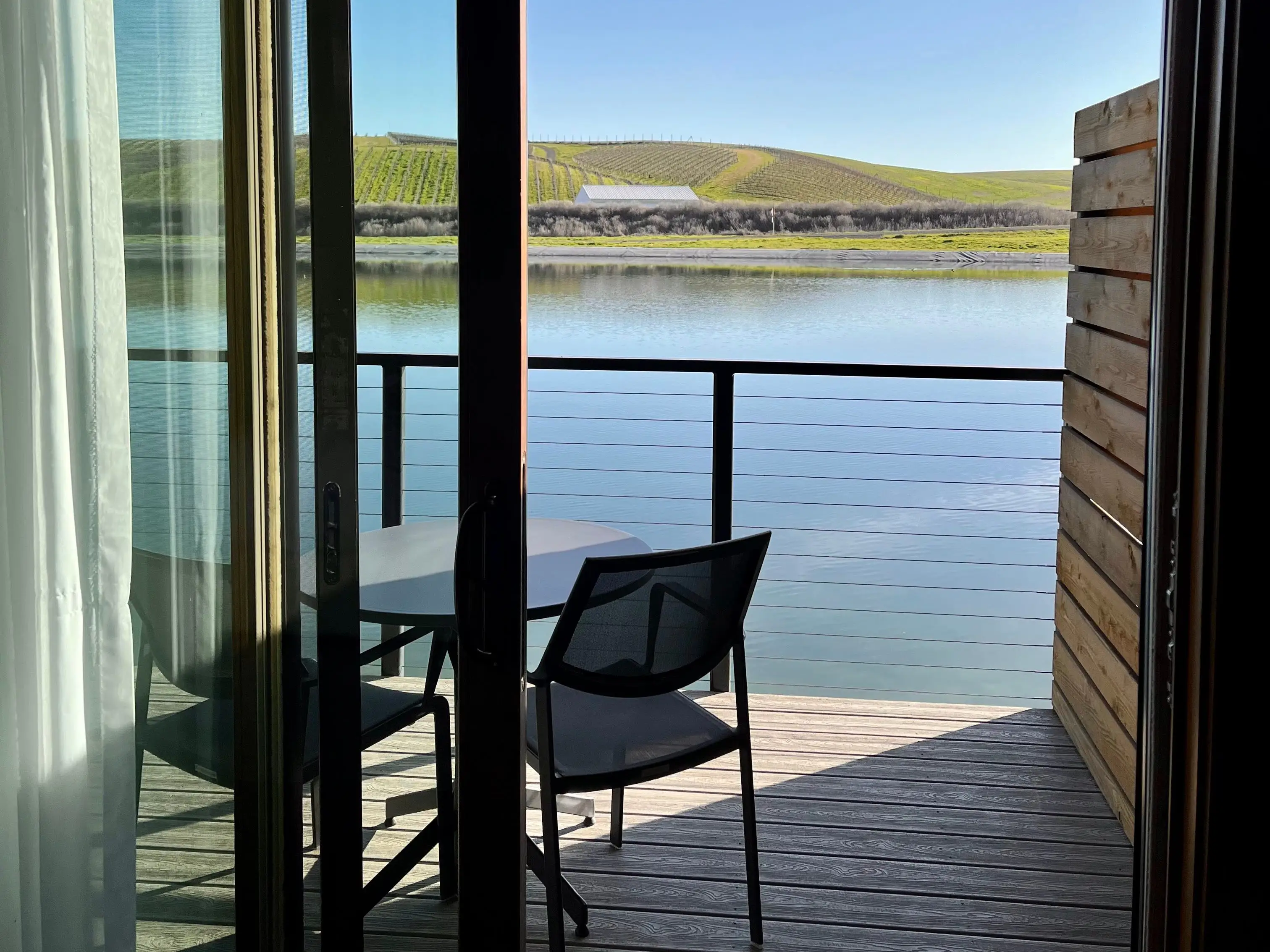 View of water, trees from balcony