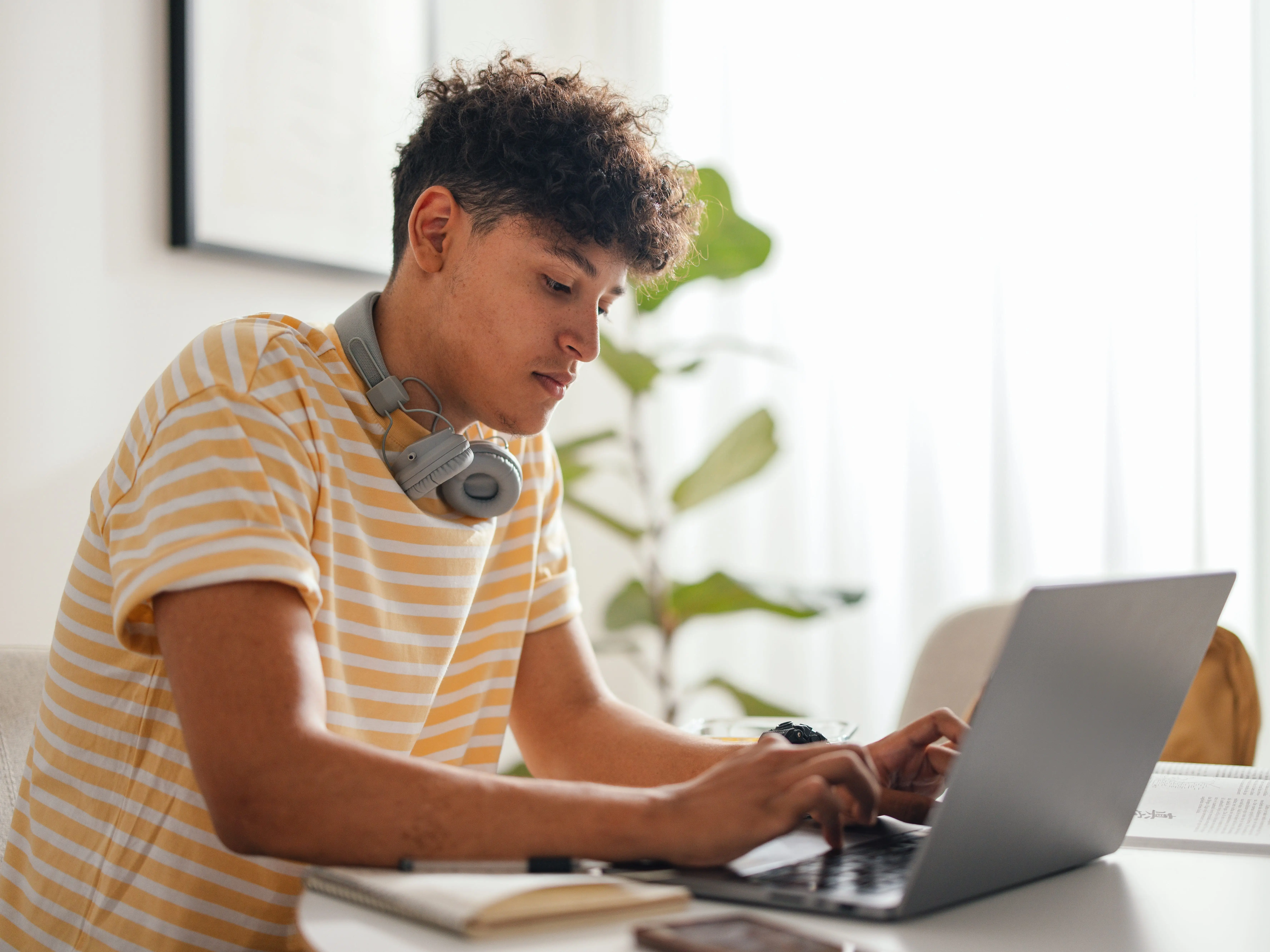 A teen coding on computer