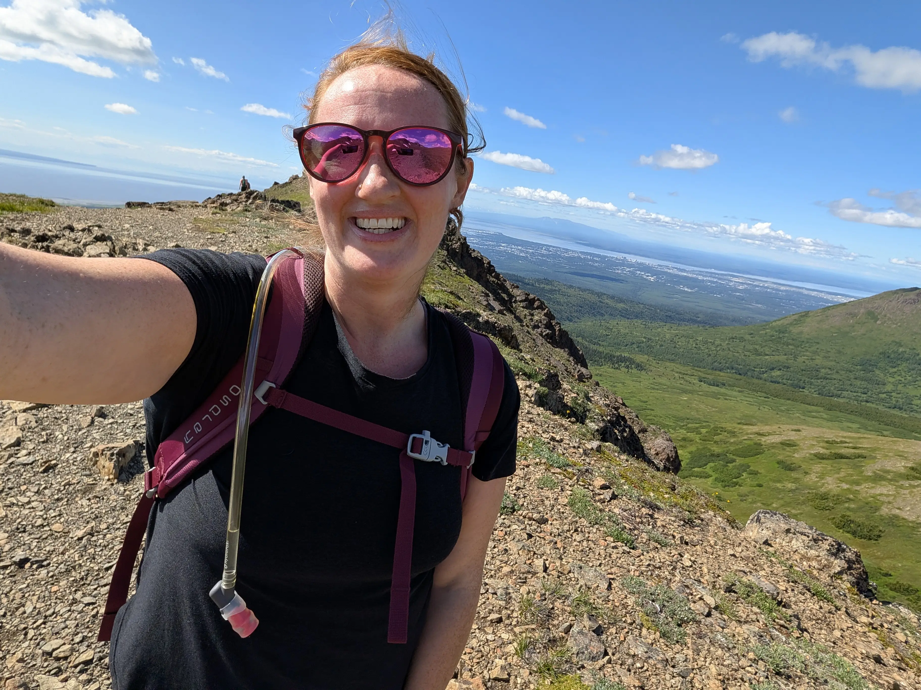 Woman smiling, hiking in Alaska