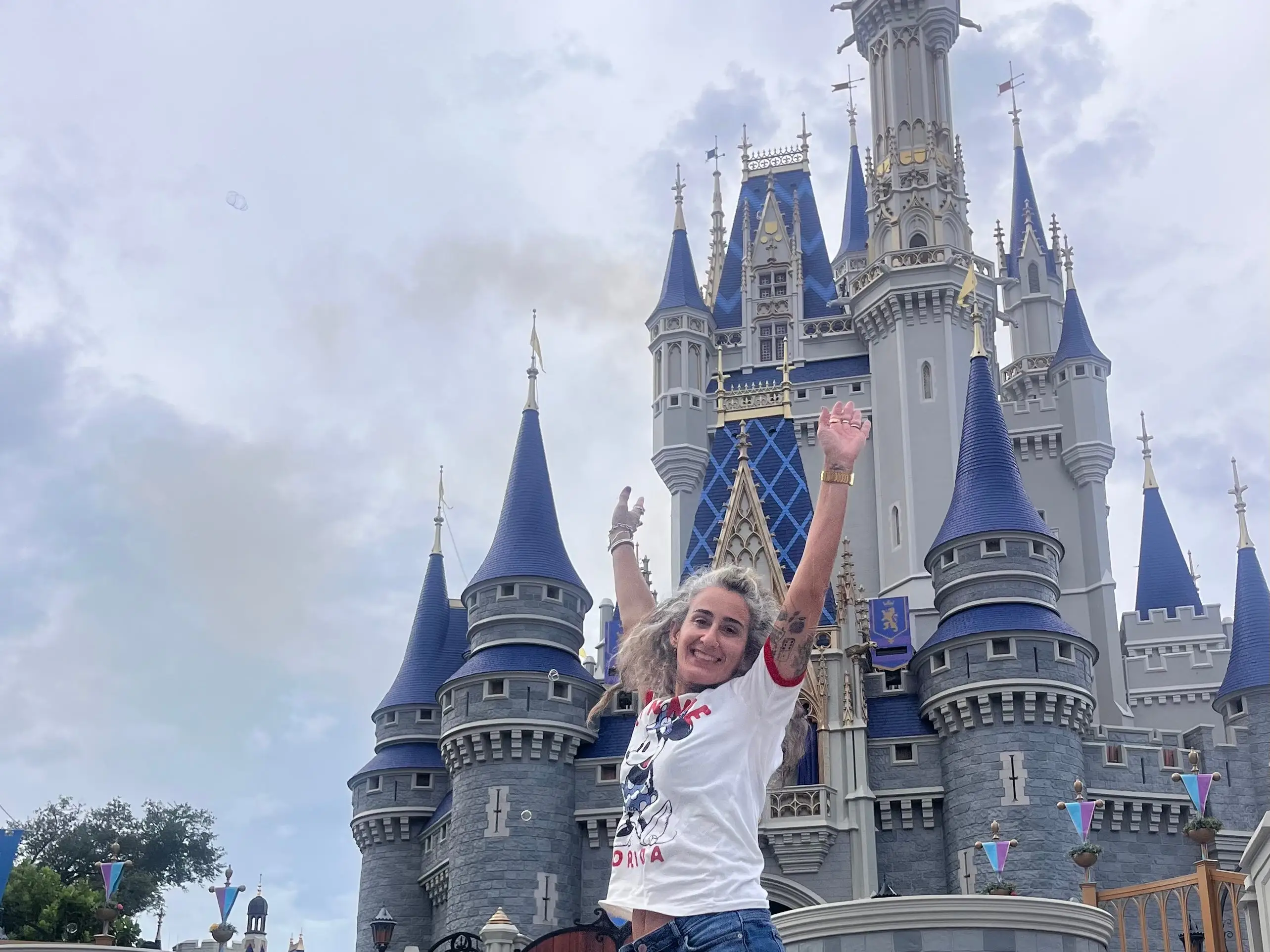 Woman jumping at Magic Kingdom