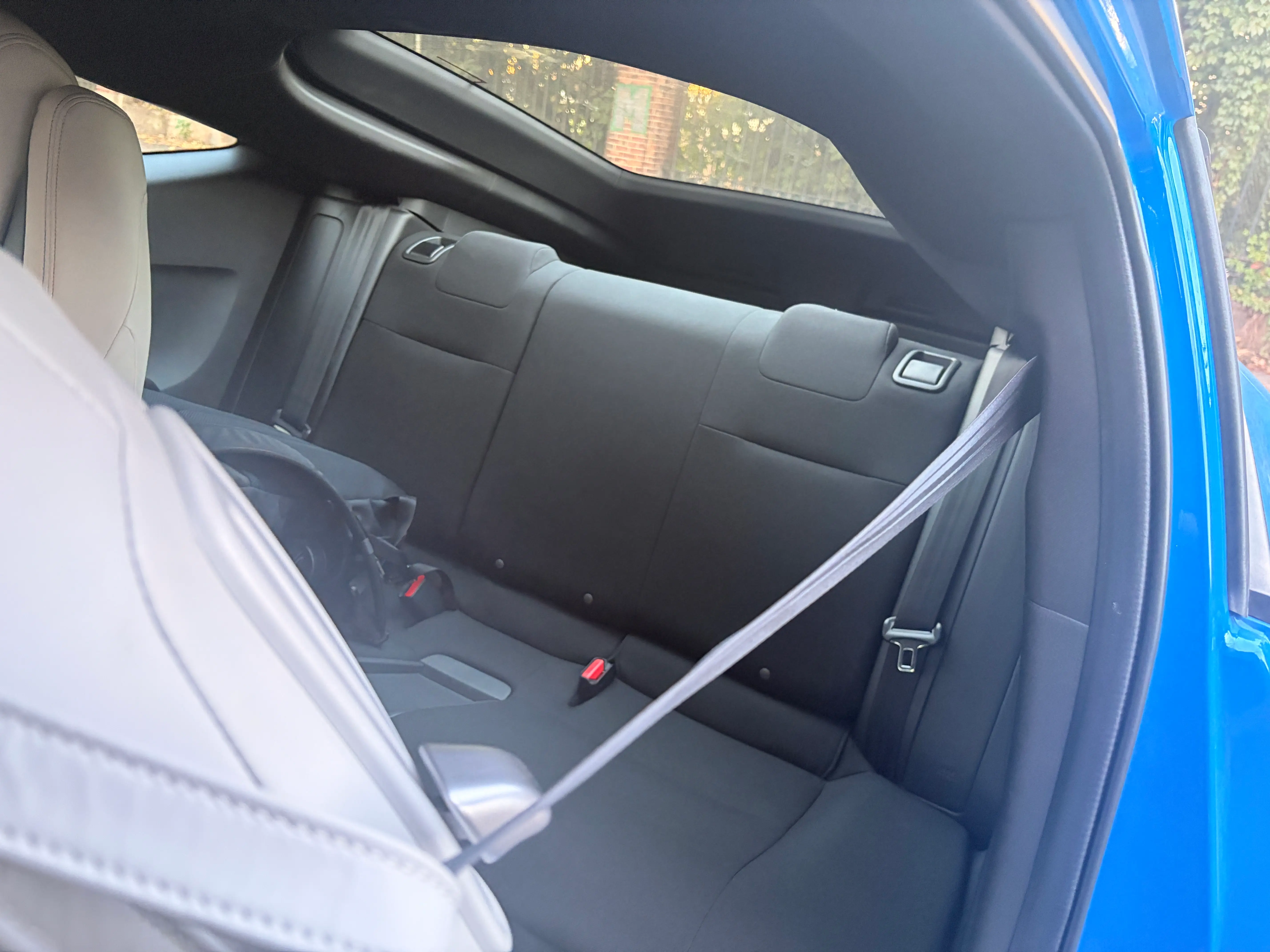 The second row of a Honda Prelude.