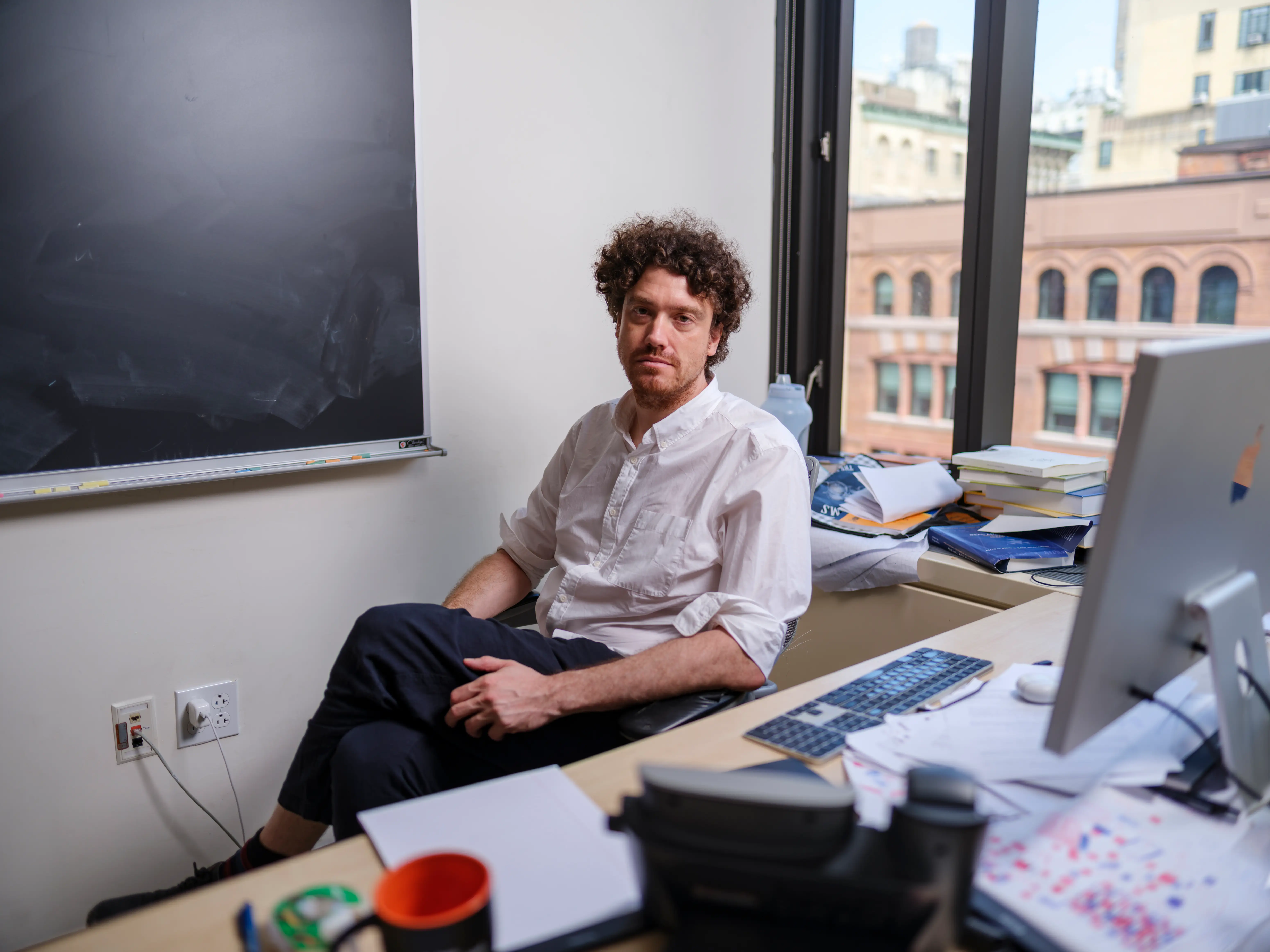 SEPTEMBER 11, 2026 : Australian mathematician Tristan Buckmaster, who is a Professor of Mathematics, Courant Institute of Mathematical Sciences, New York University, poses for a portrait in his office in Manhattan on September 11, 2026. Dr. Buckmaster and the mathematician Levent Alpöge, who have been working on