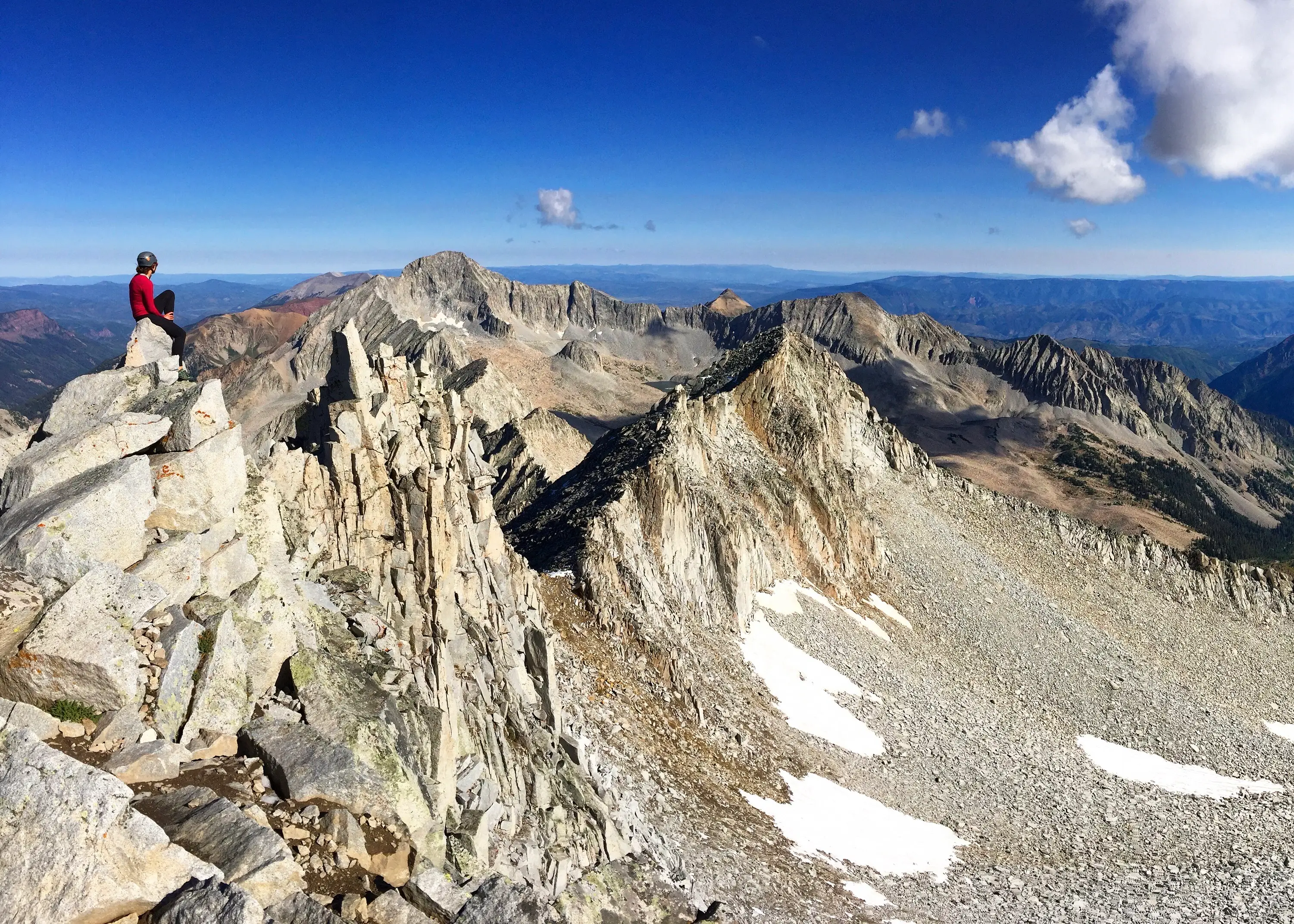 Woman atop mountain
