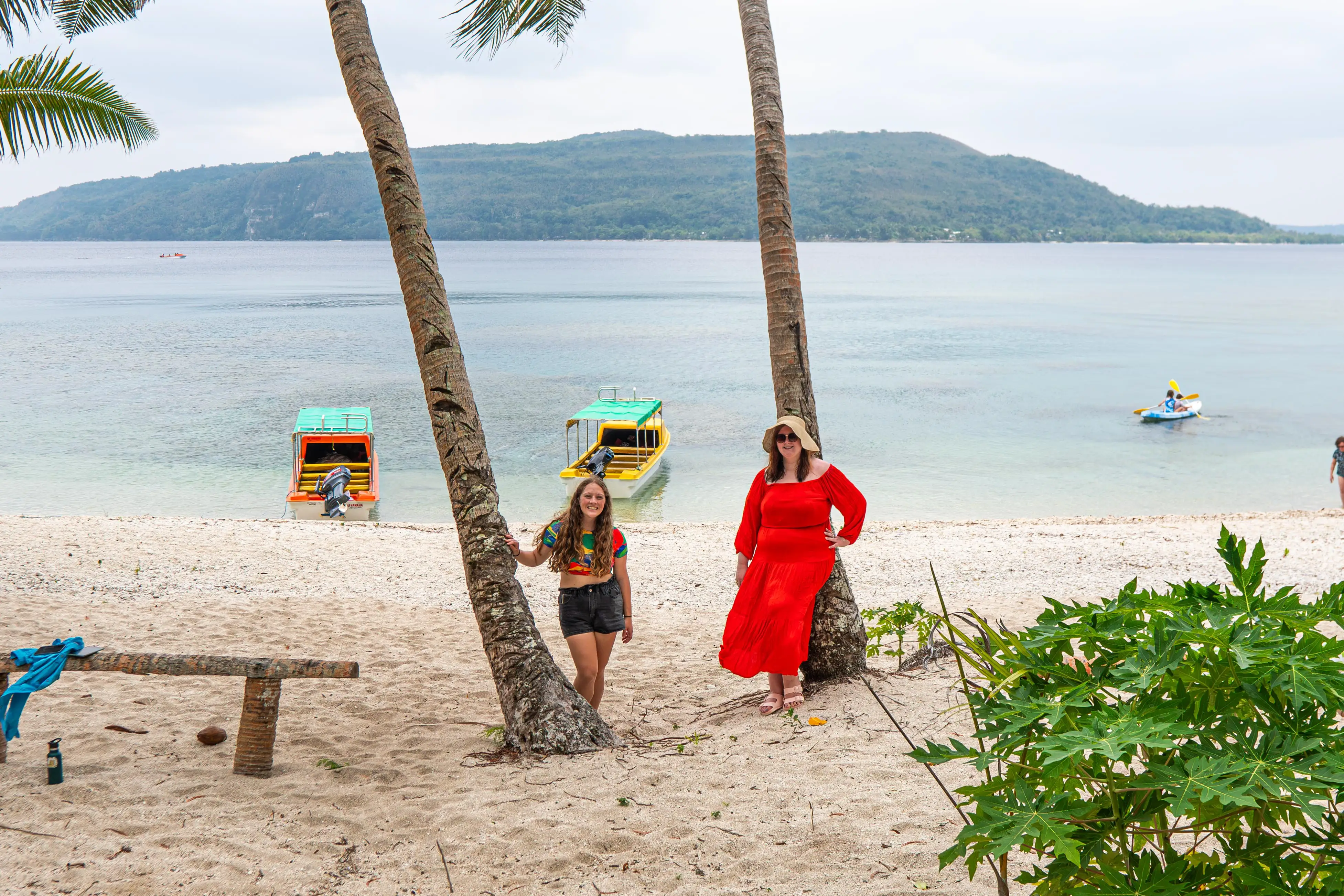 Two women smiling on beach