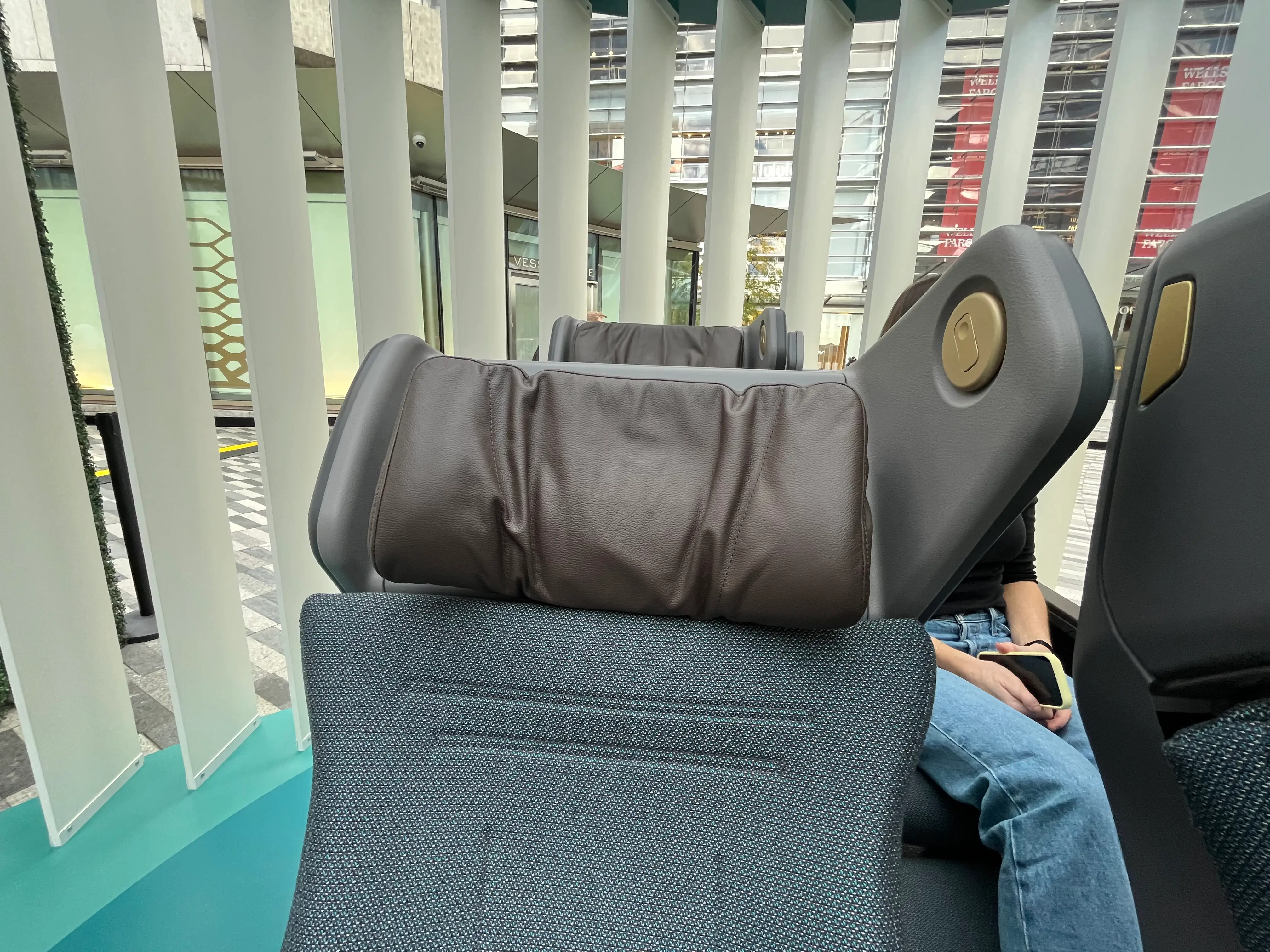 A leather headrest with movable wings.