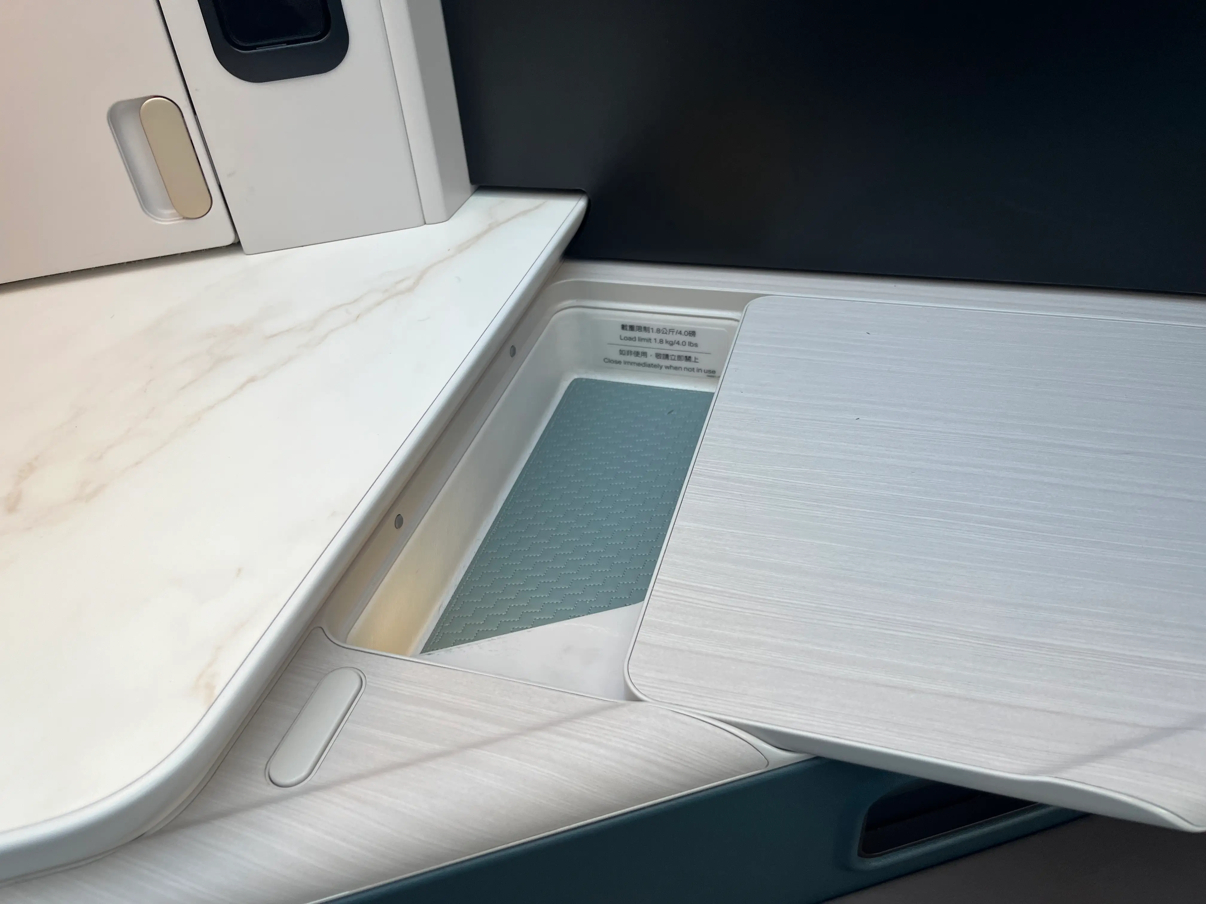 Hidden compartments and wireless charging in the Aria Suite.