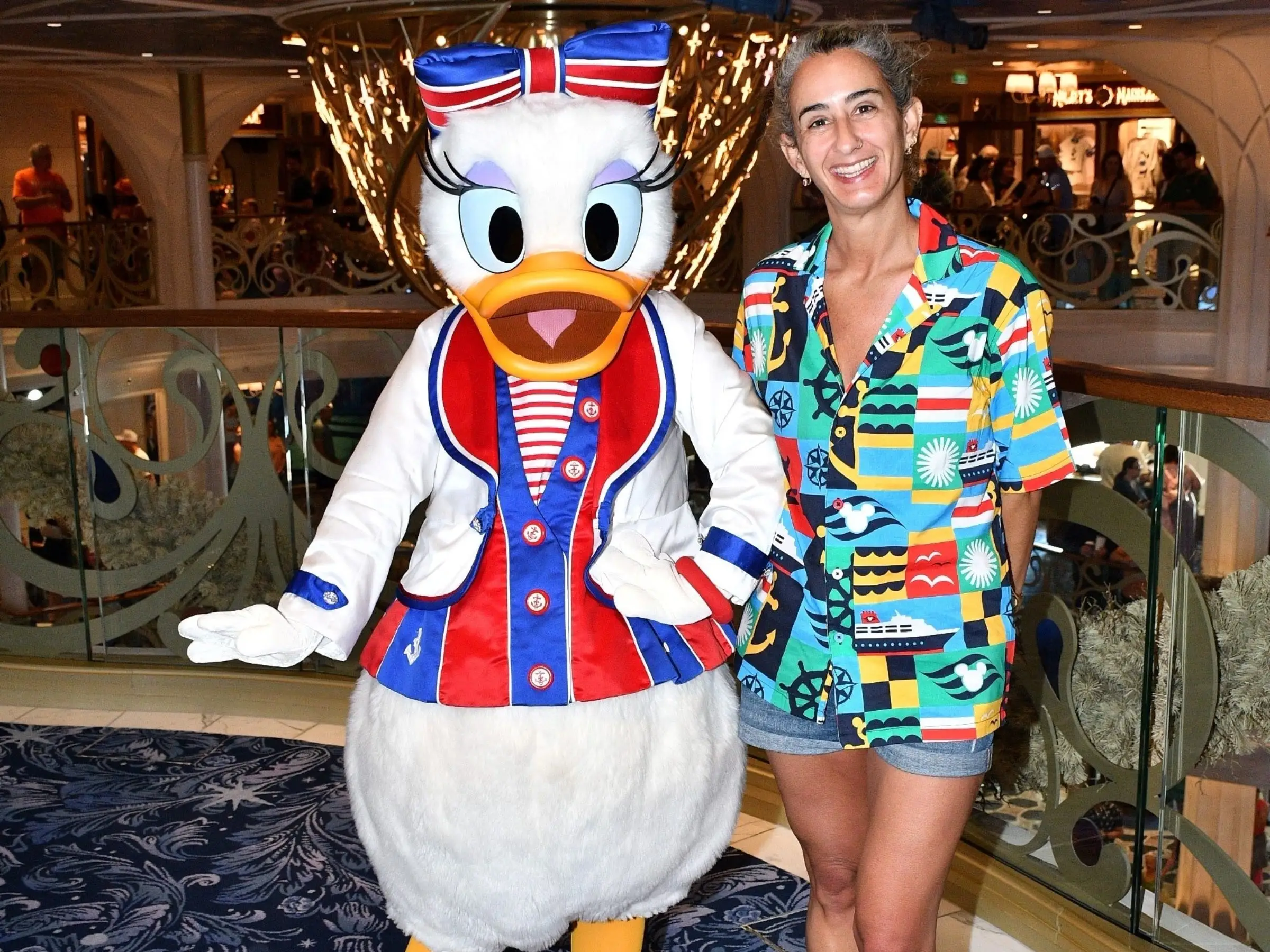 Woman posing with Daisy Duck