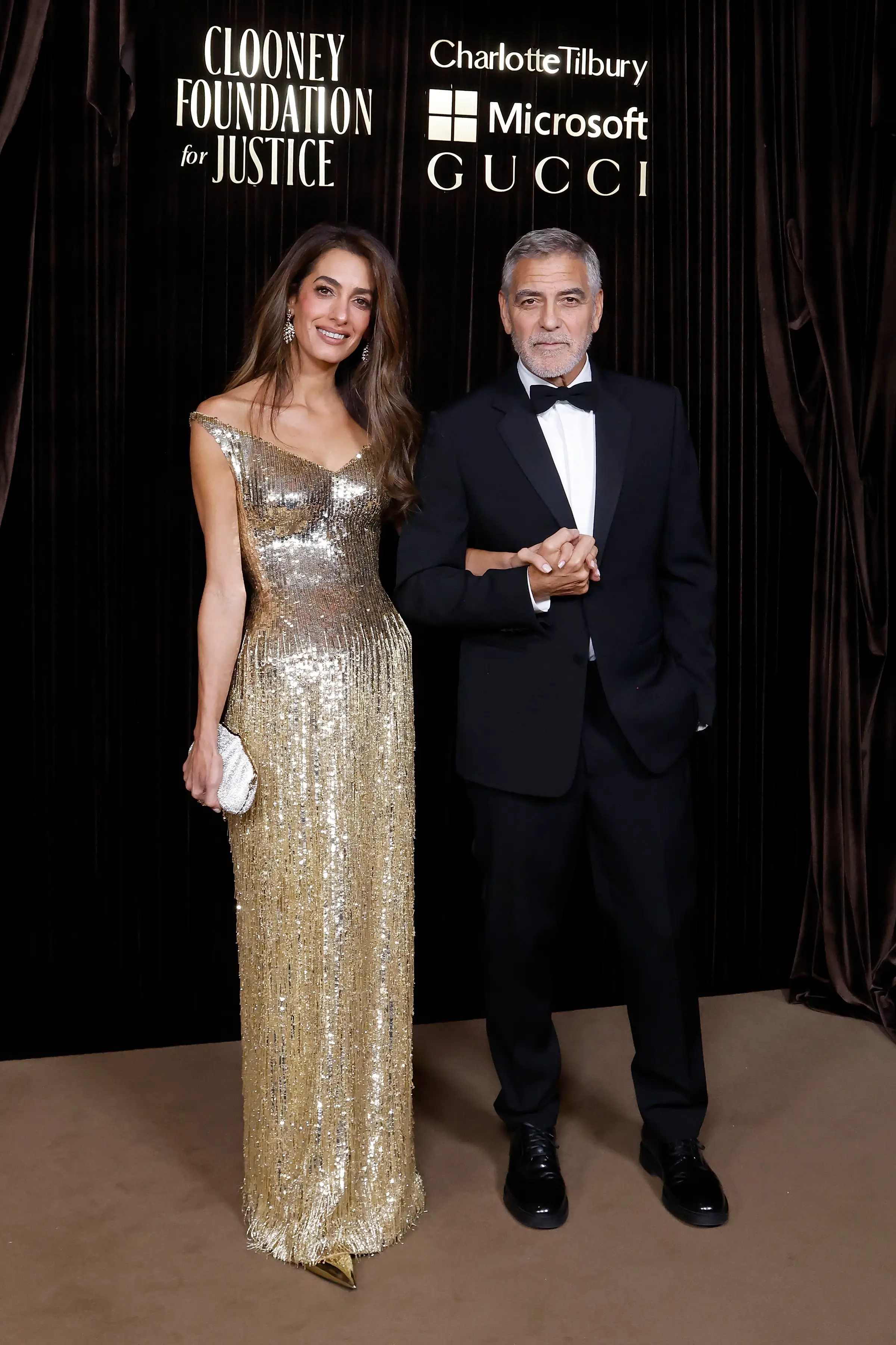 Amal Clooney and George Clooney at the 2026 Albies in London.