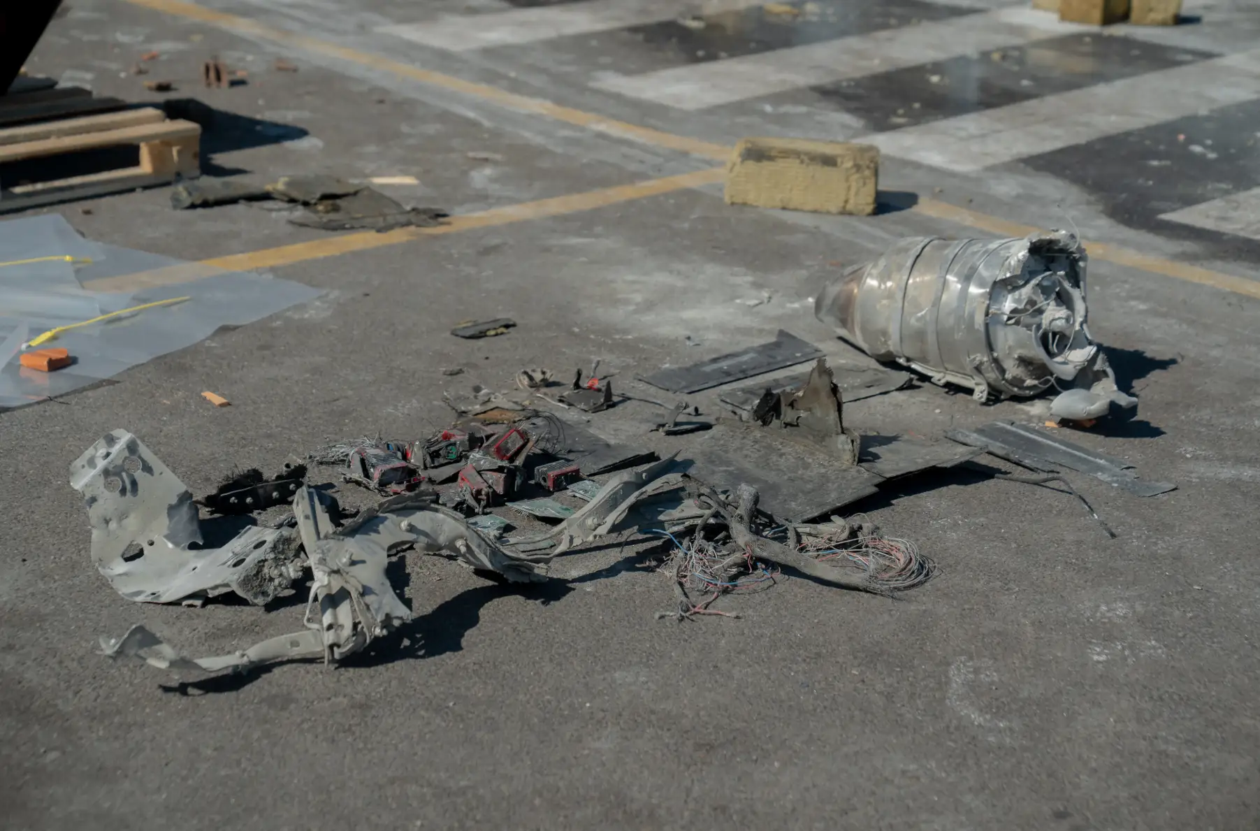 Debris of a drone lies on the ground near the Epicenter retail center following a Russian Geran-4 strike in Kharkiv.