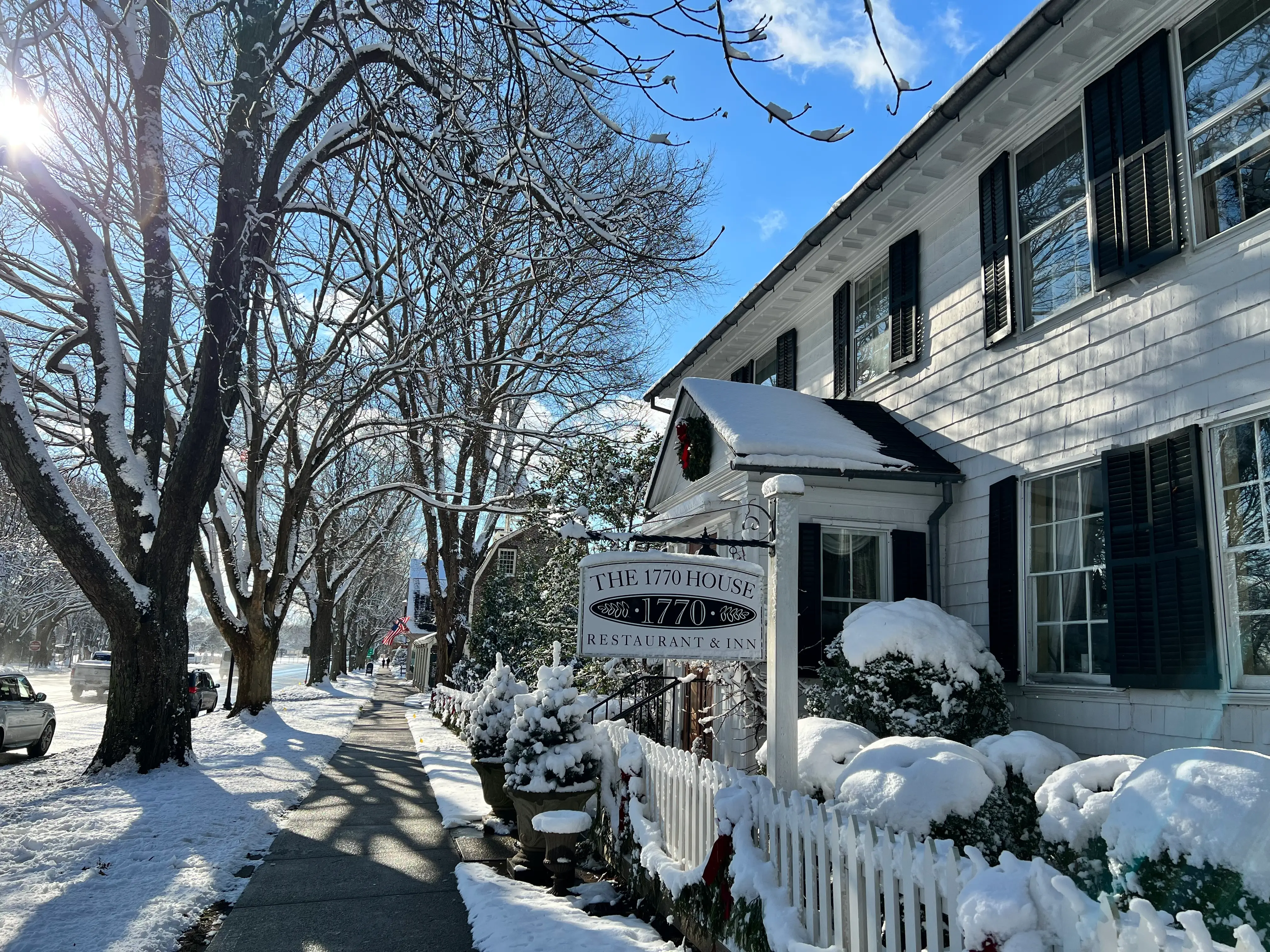 Snow-covered sidewalk next to the 1770 House Restaurant & Inn in East Hampton, New York.
