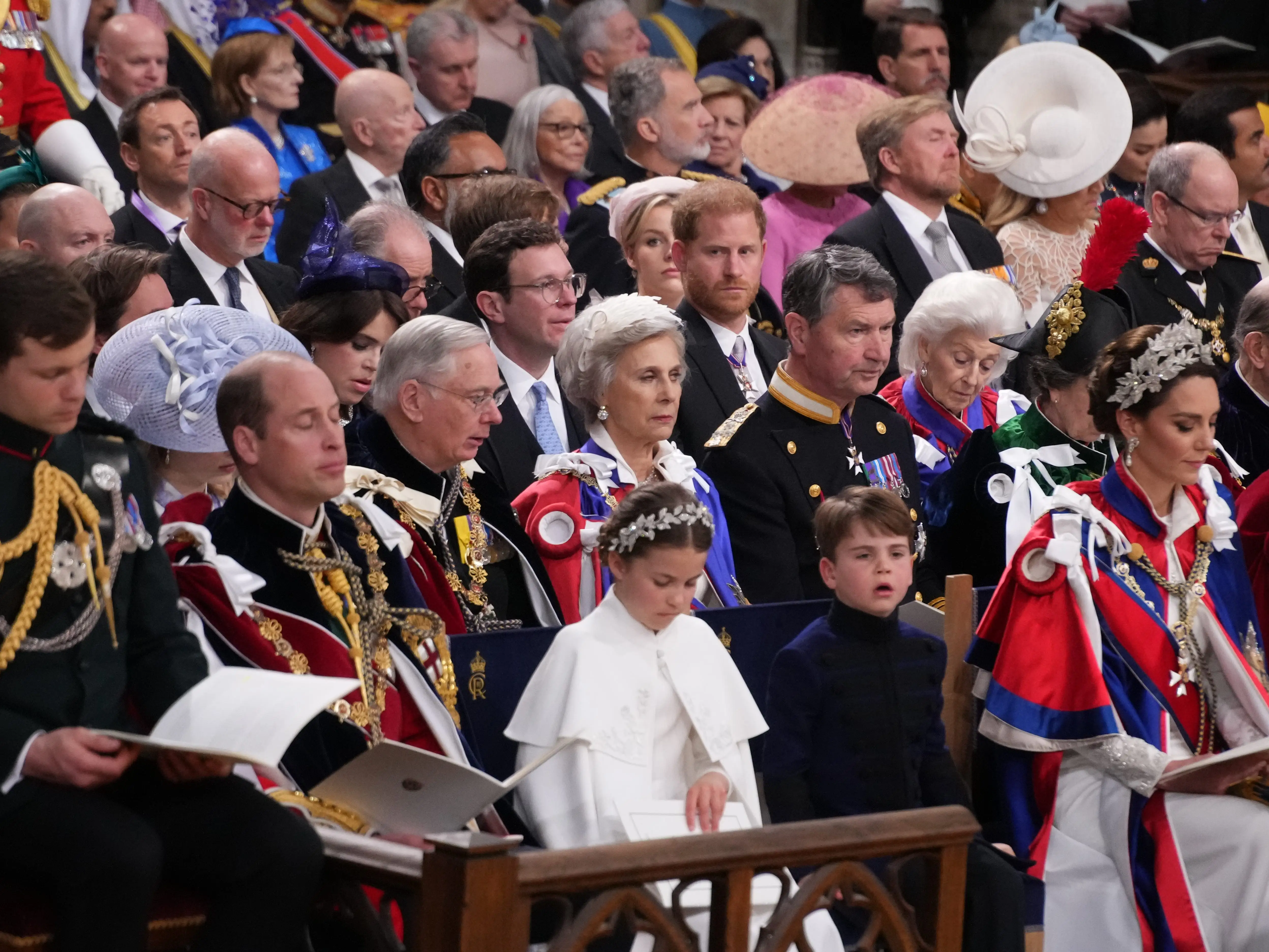 Members of the royal family sit in rows during King Charles' coronation.