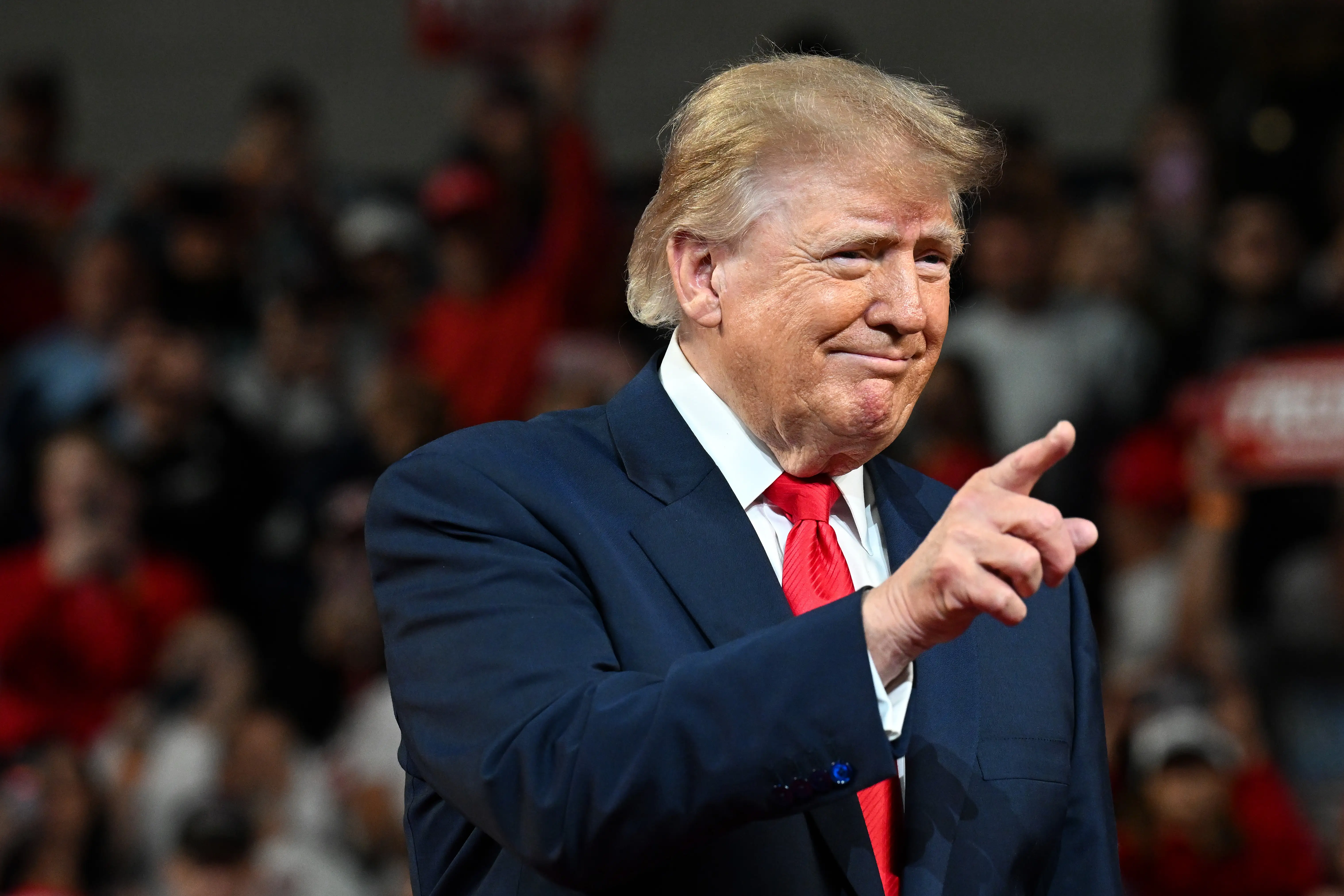 Donald Trump points during a rally